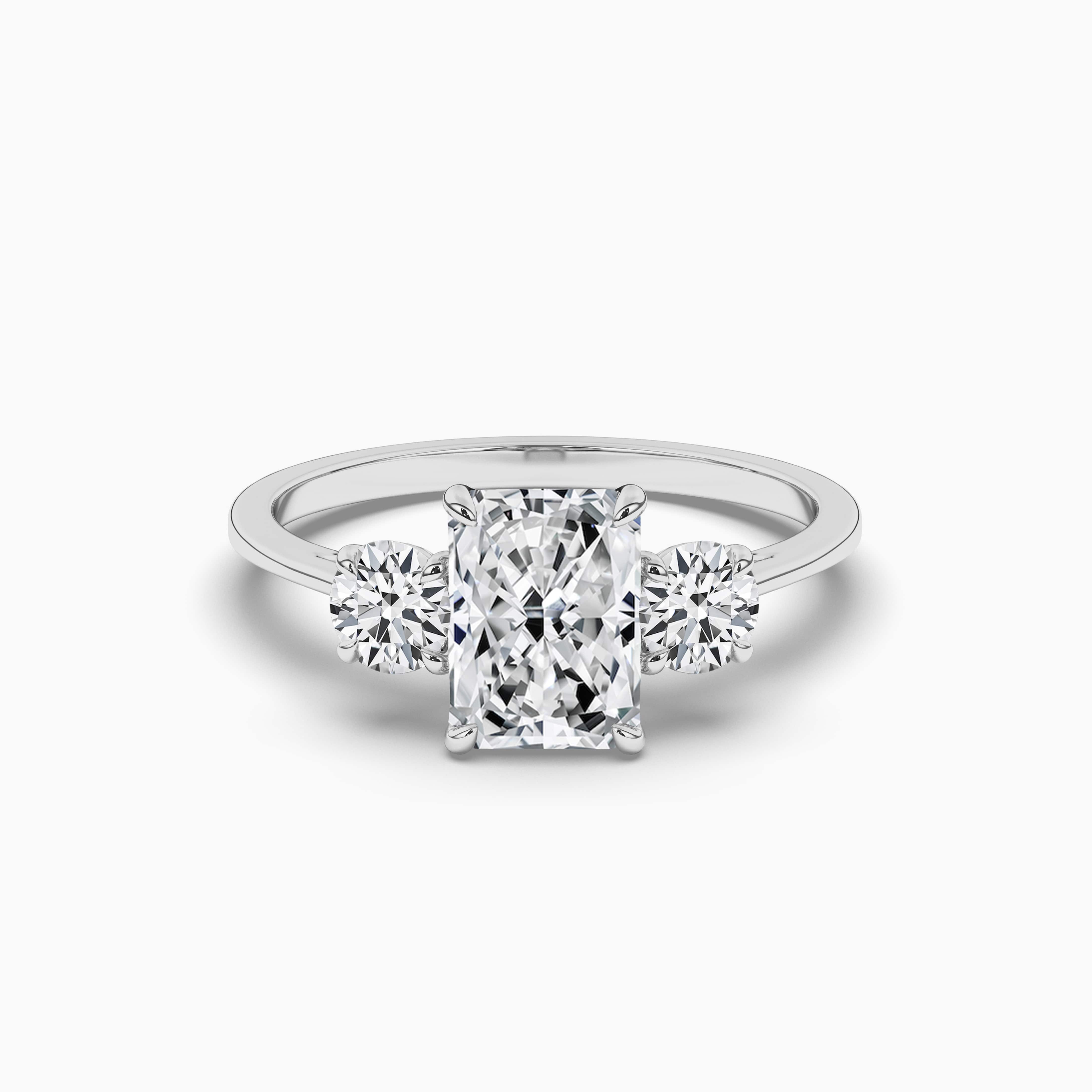 WHITE GOLD THREE STONE RADIANT SHAPE DIAMOND RING