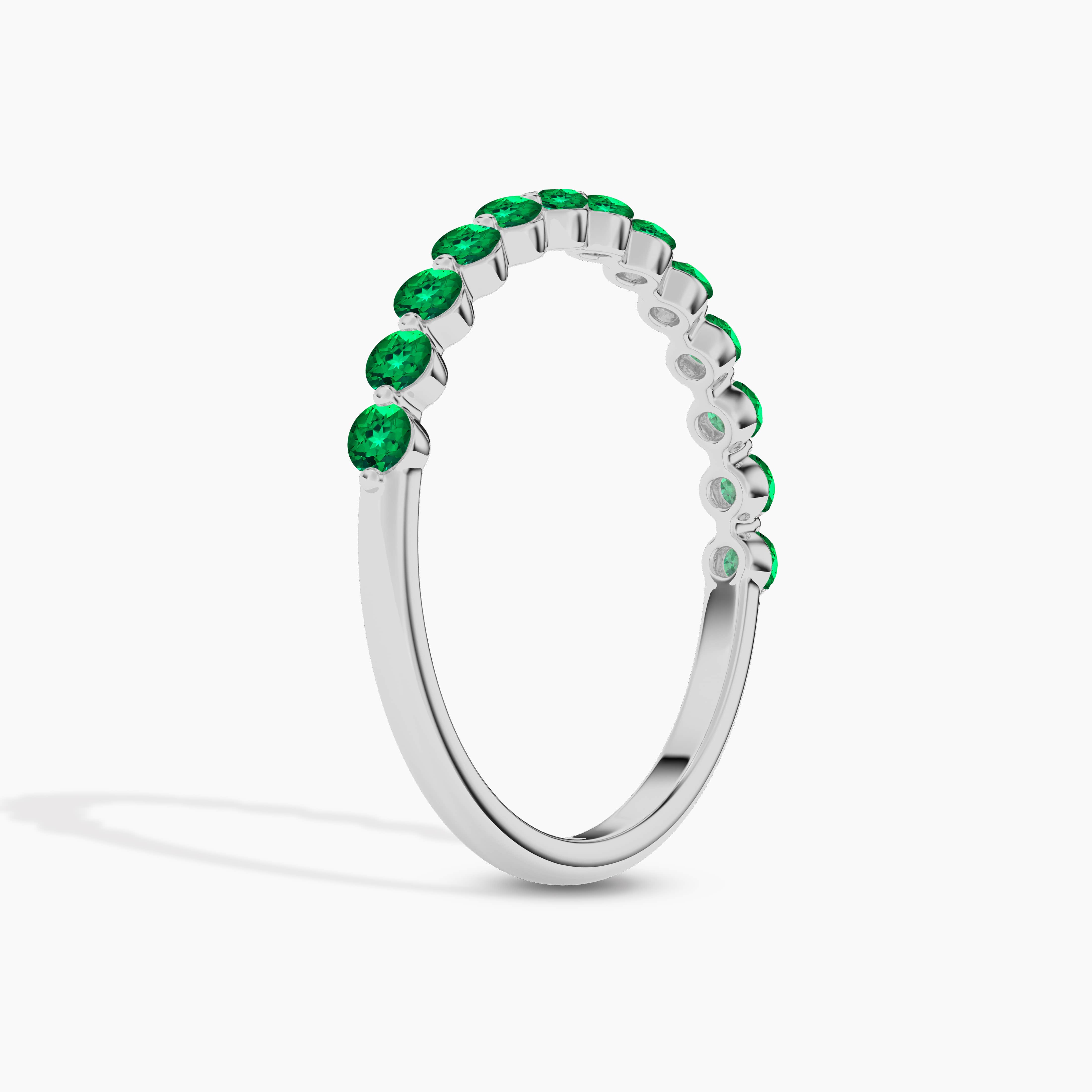 Green Emerald Cut Eternity Wedding Band In White Gold