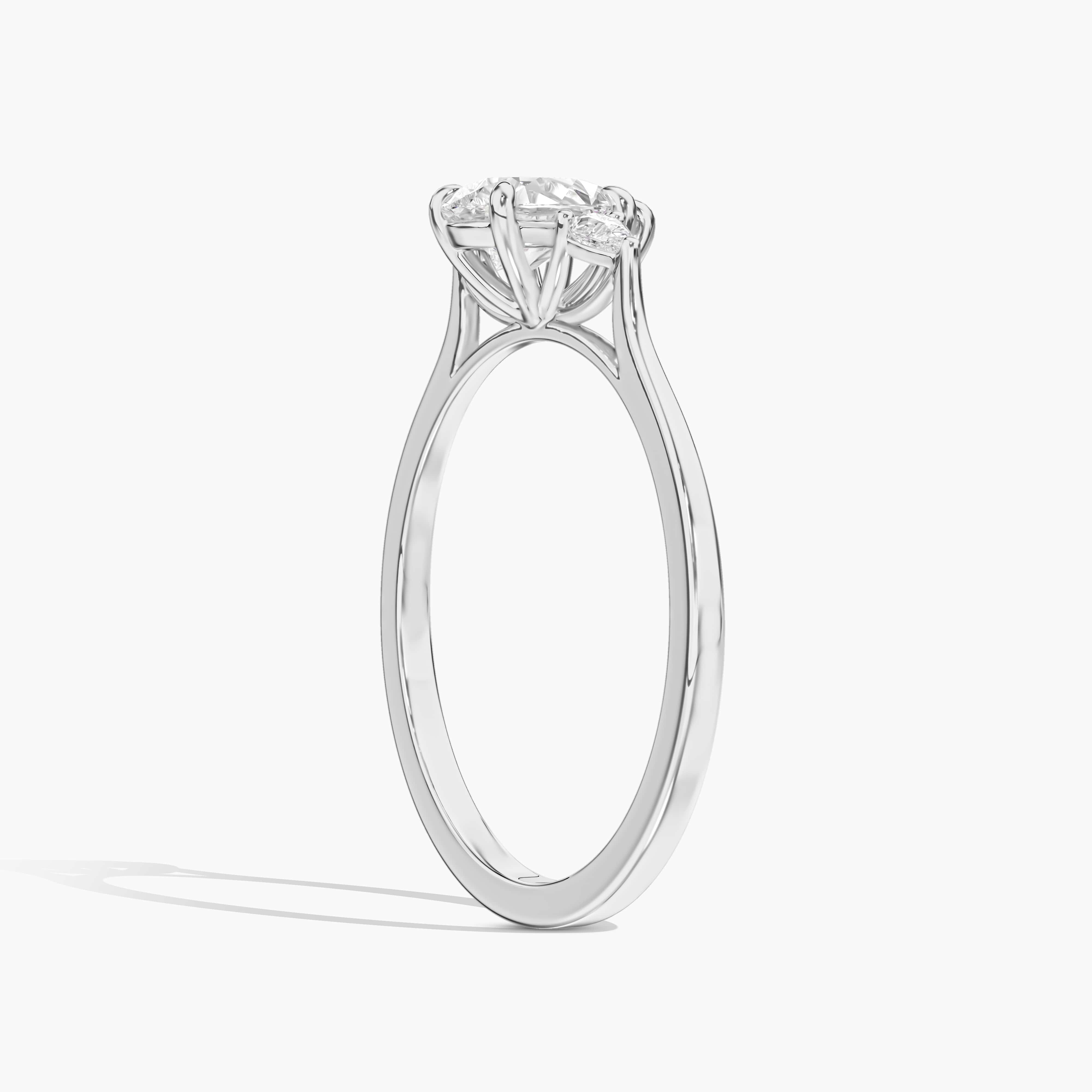 Pear Cut Solitaire with Baguette Diamond Accents white Gold Ring