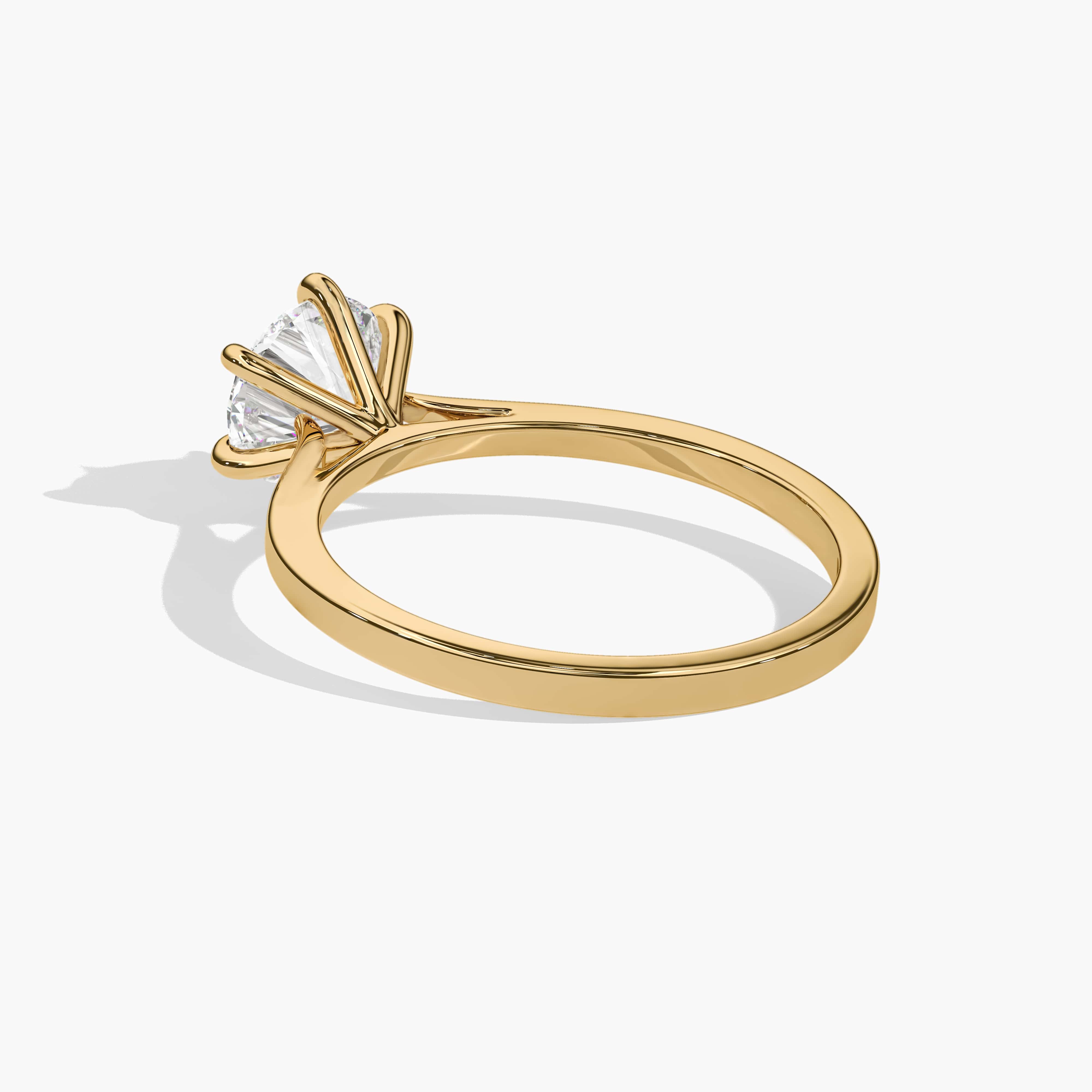 engagement ring with cathedral setting yellow gold