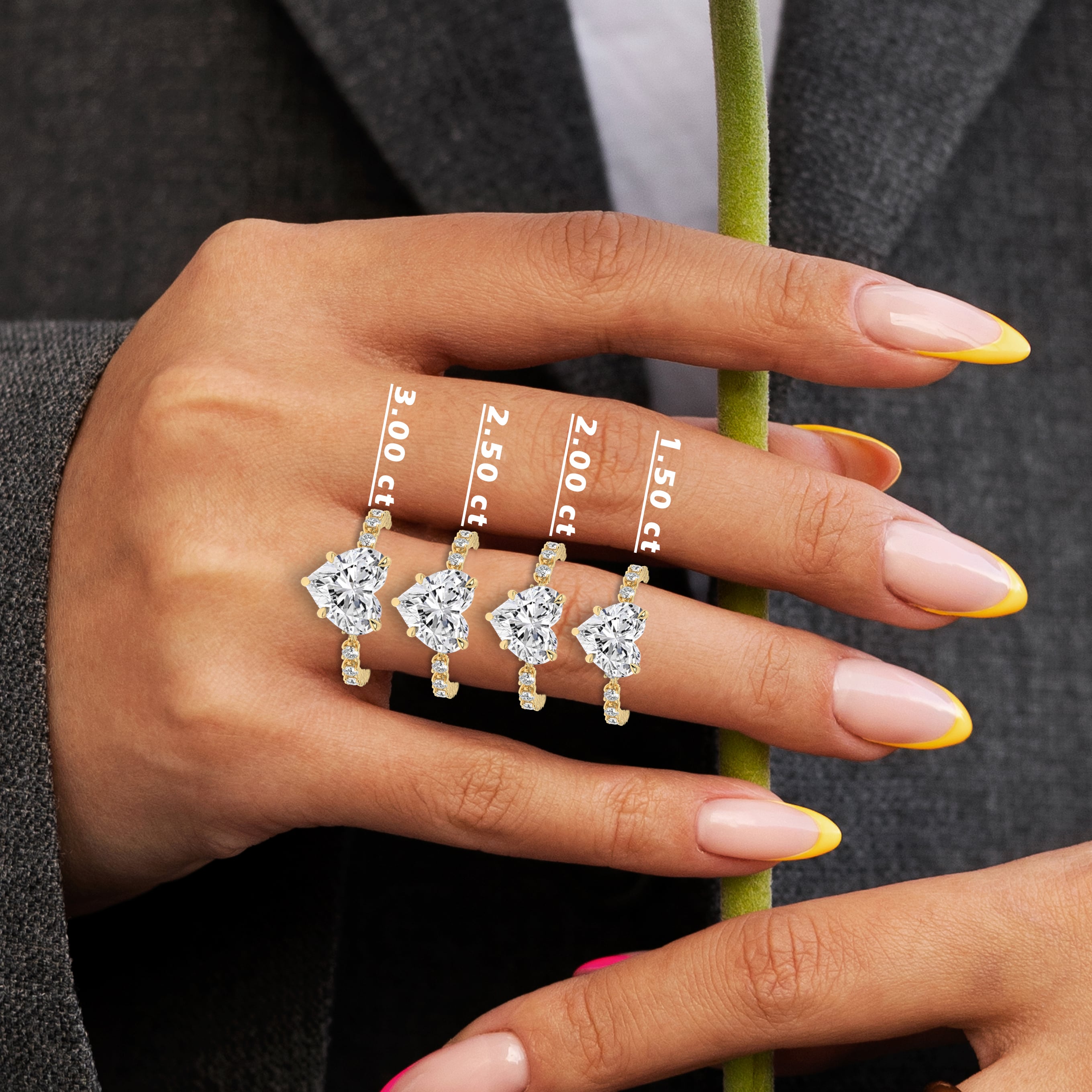 heart cut diamond engagement ring on woman hand
