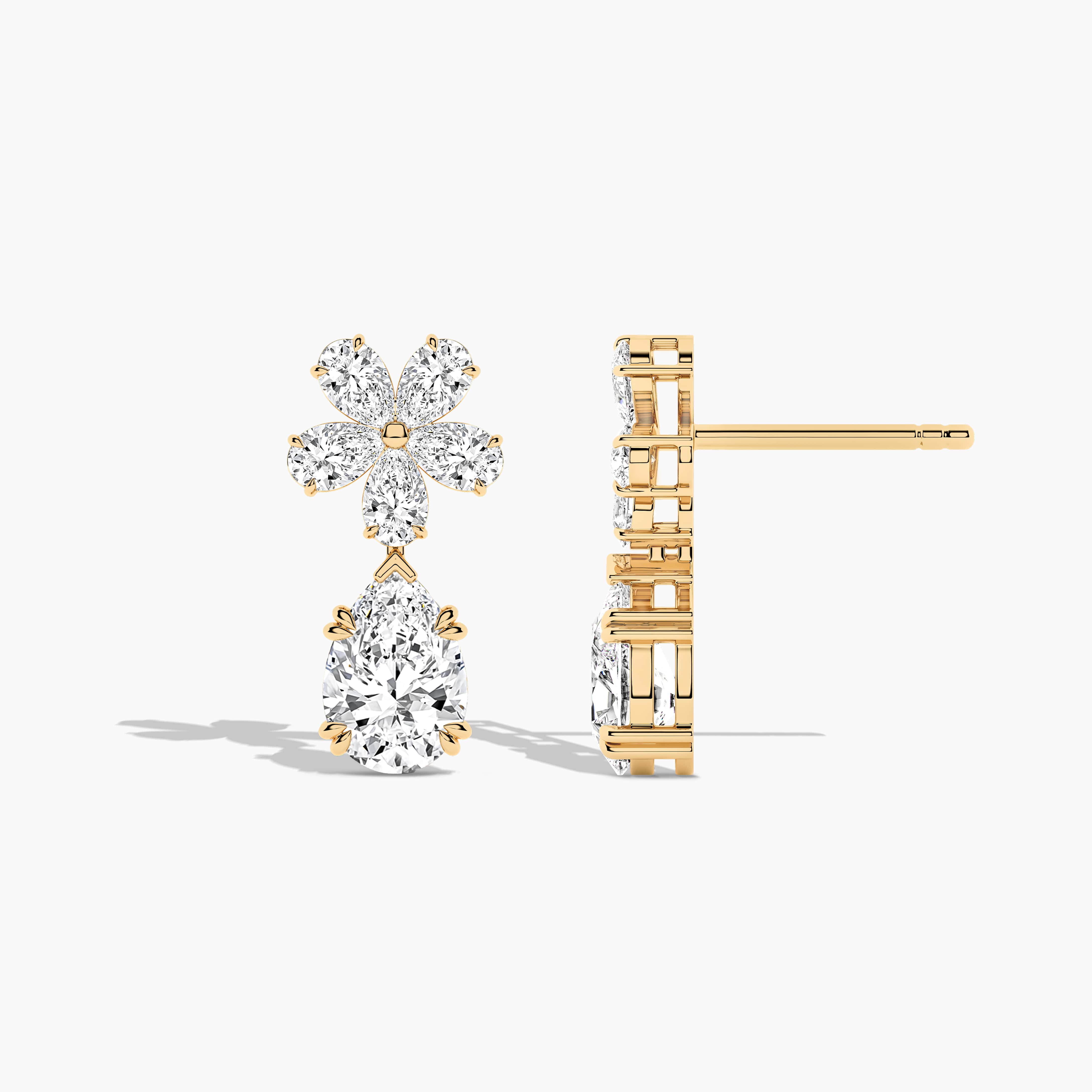 a pair of gold and diamond earrings