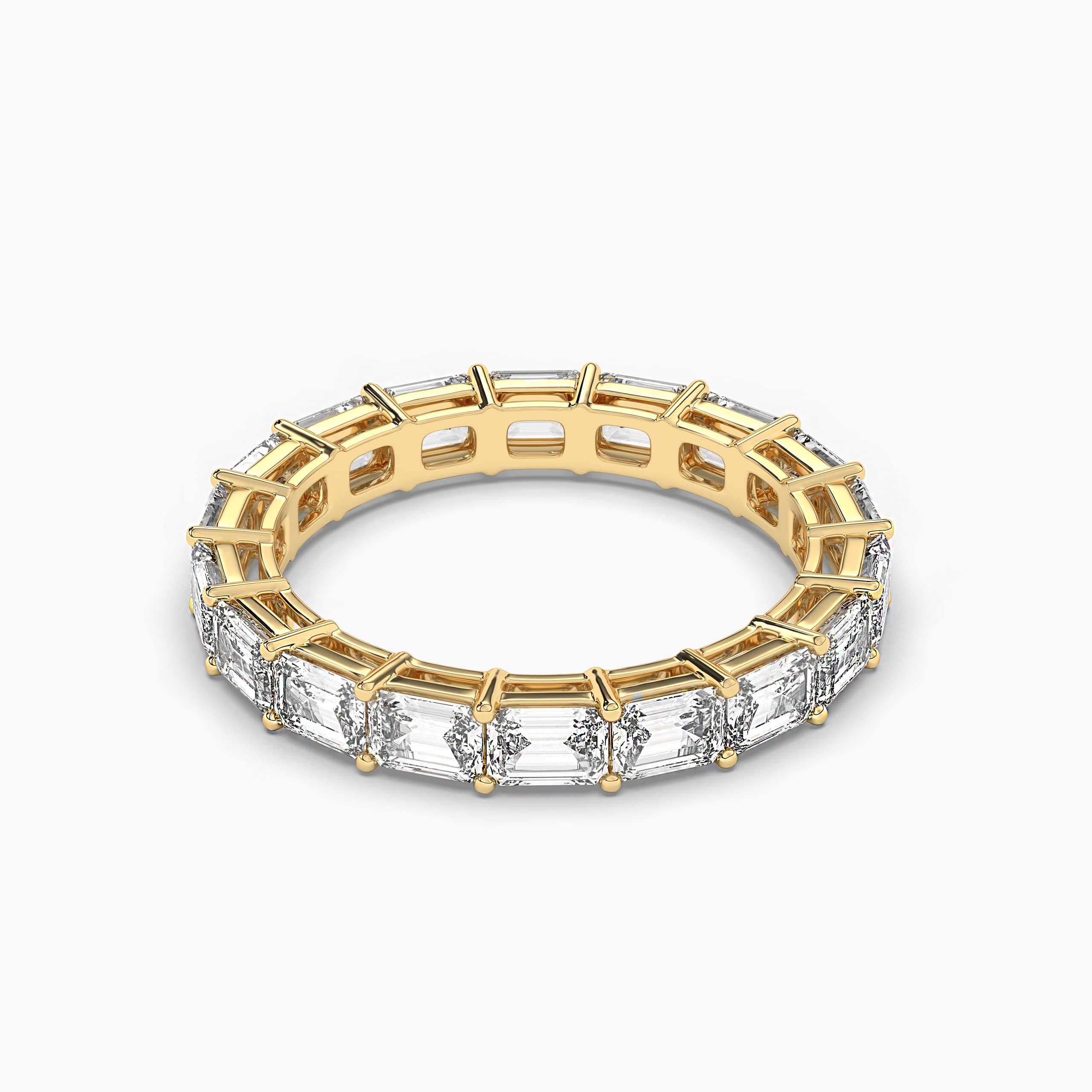 East West Emerald Cut Eternity Ring In Yellow Gold