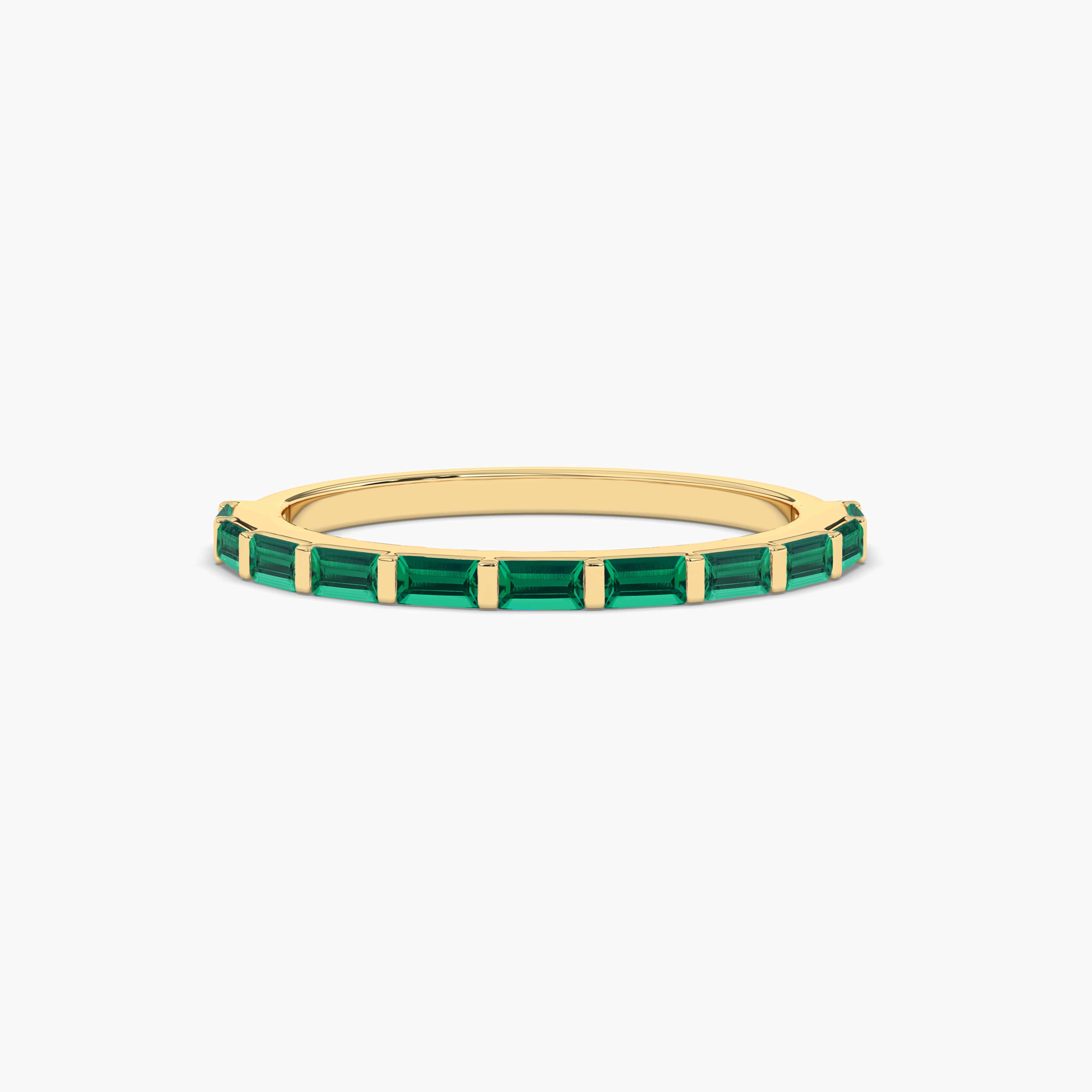 emerald baguette half eternity band in yellow gold