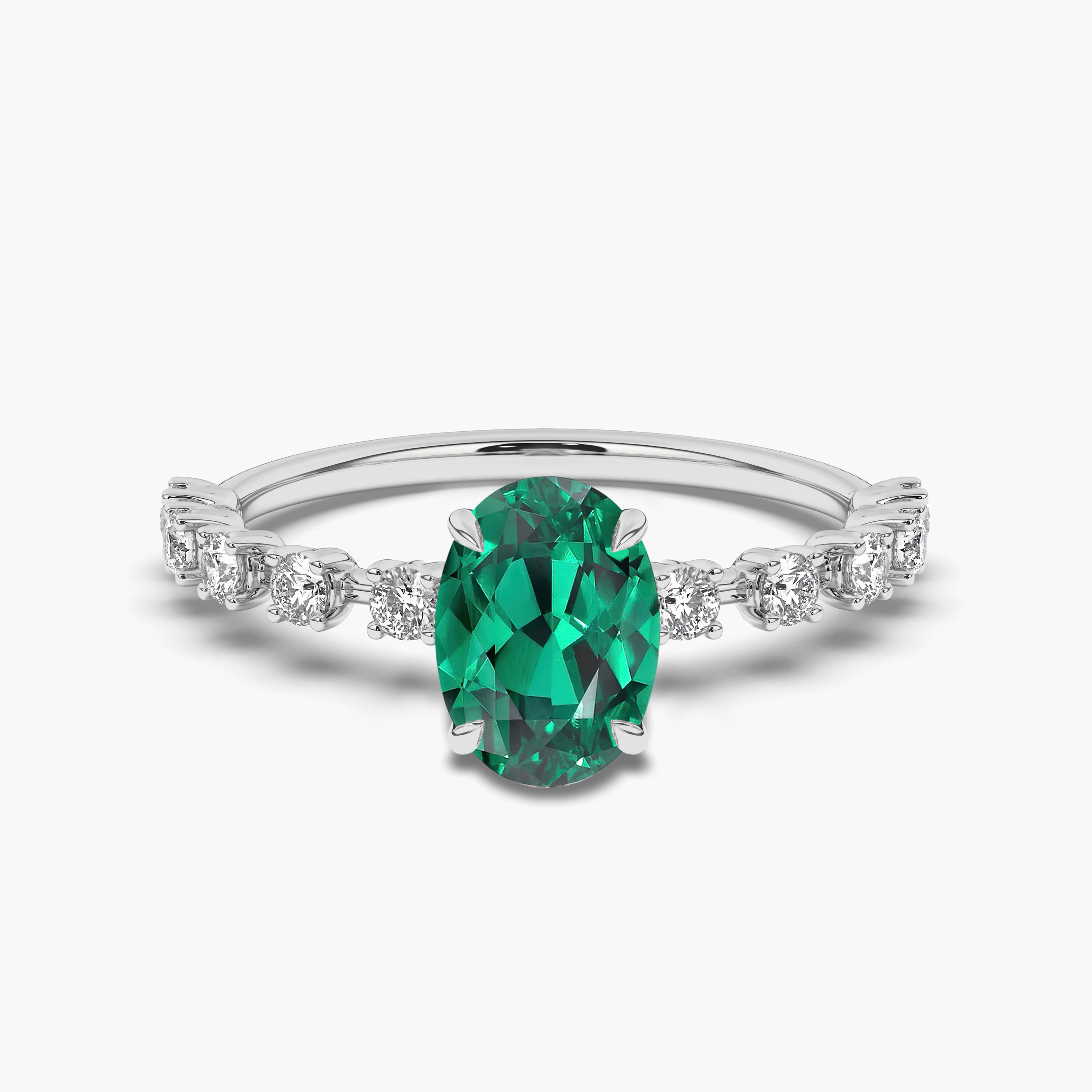 WHITE GOLD OVAL EMERALD AND DIAMOND RING