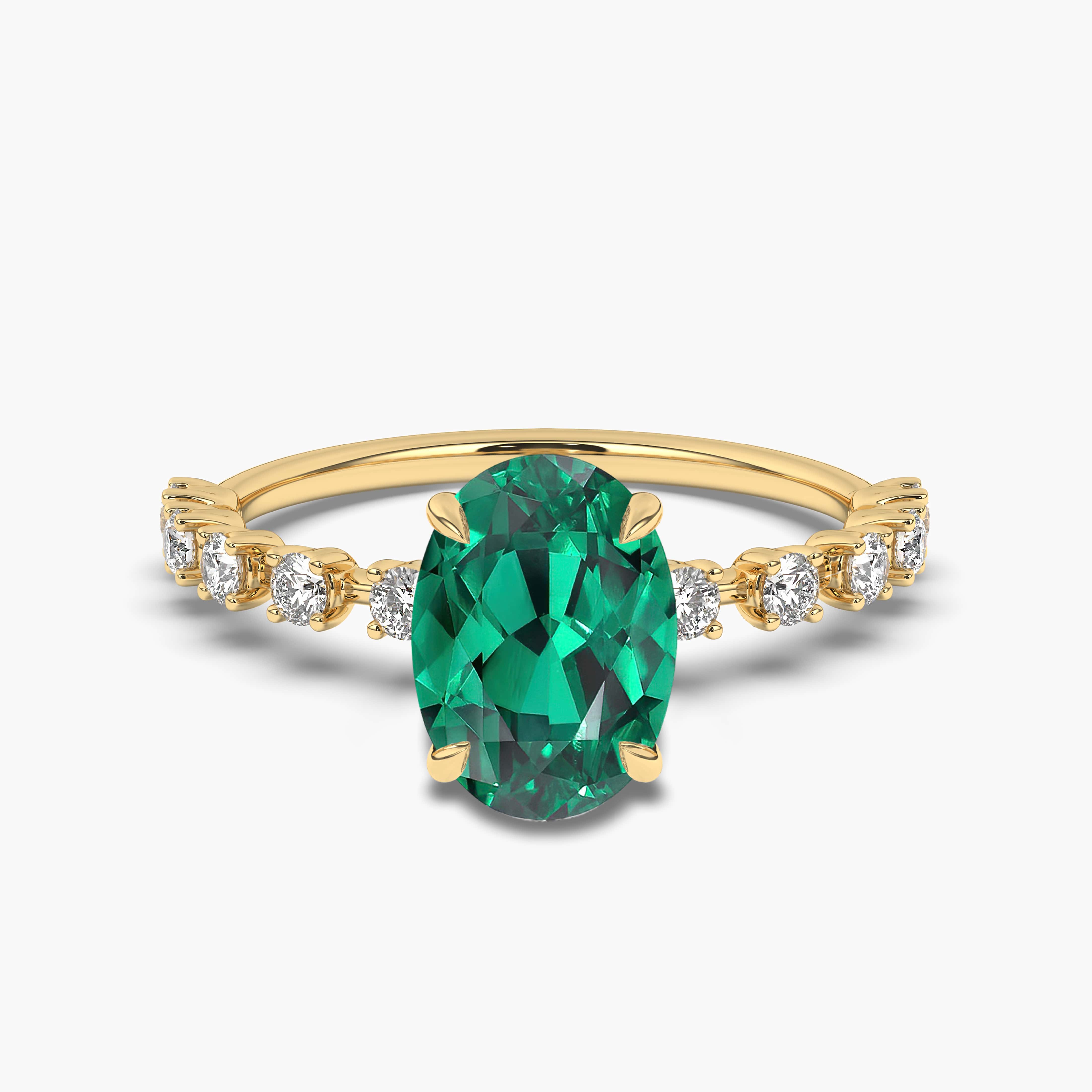 OVAL EMERALD AND DIAMOND RING IN YELLOW GOLD