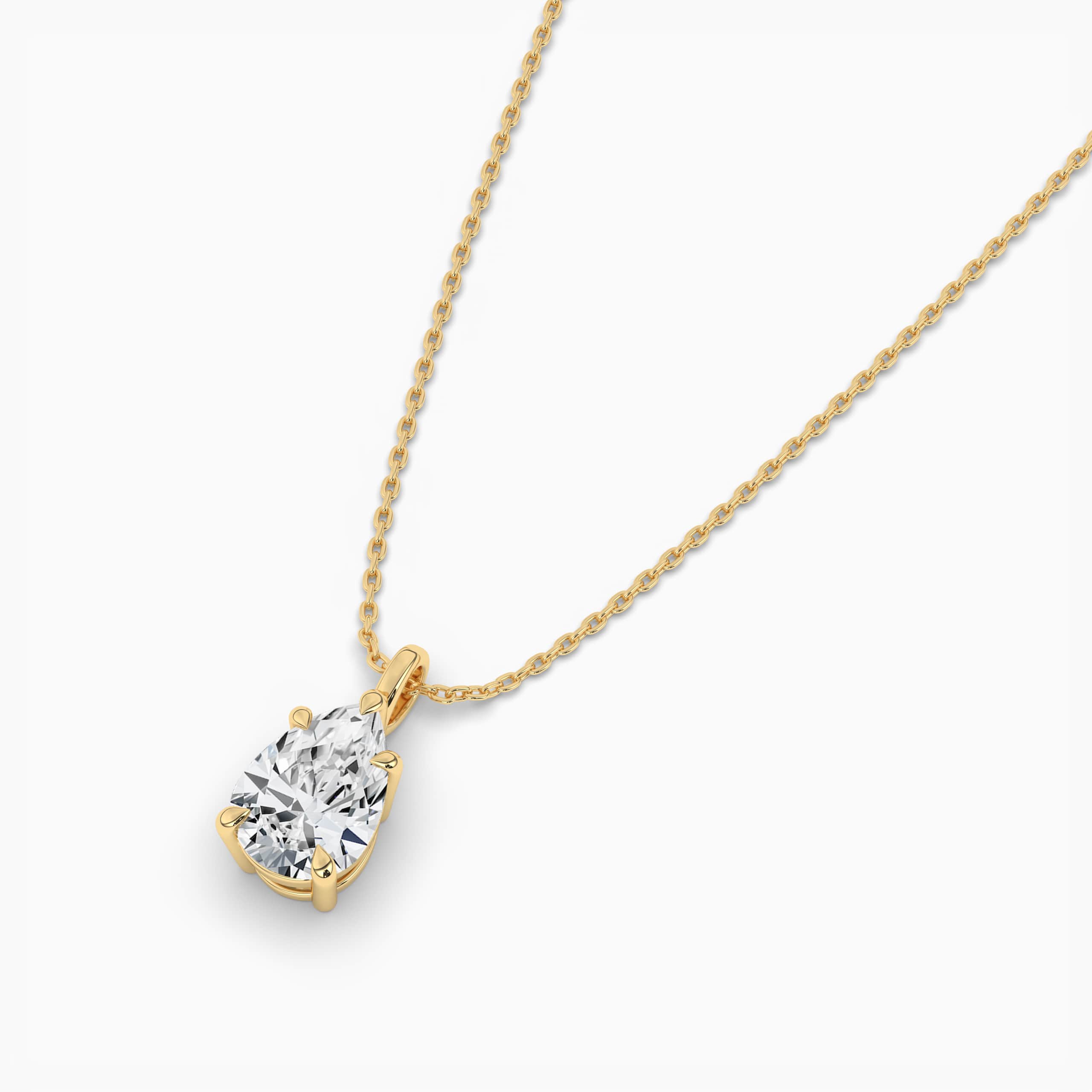 yellow gold solitaire pendant with pear shaped diamond