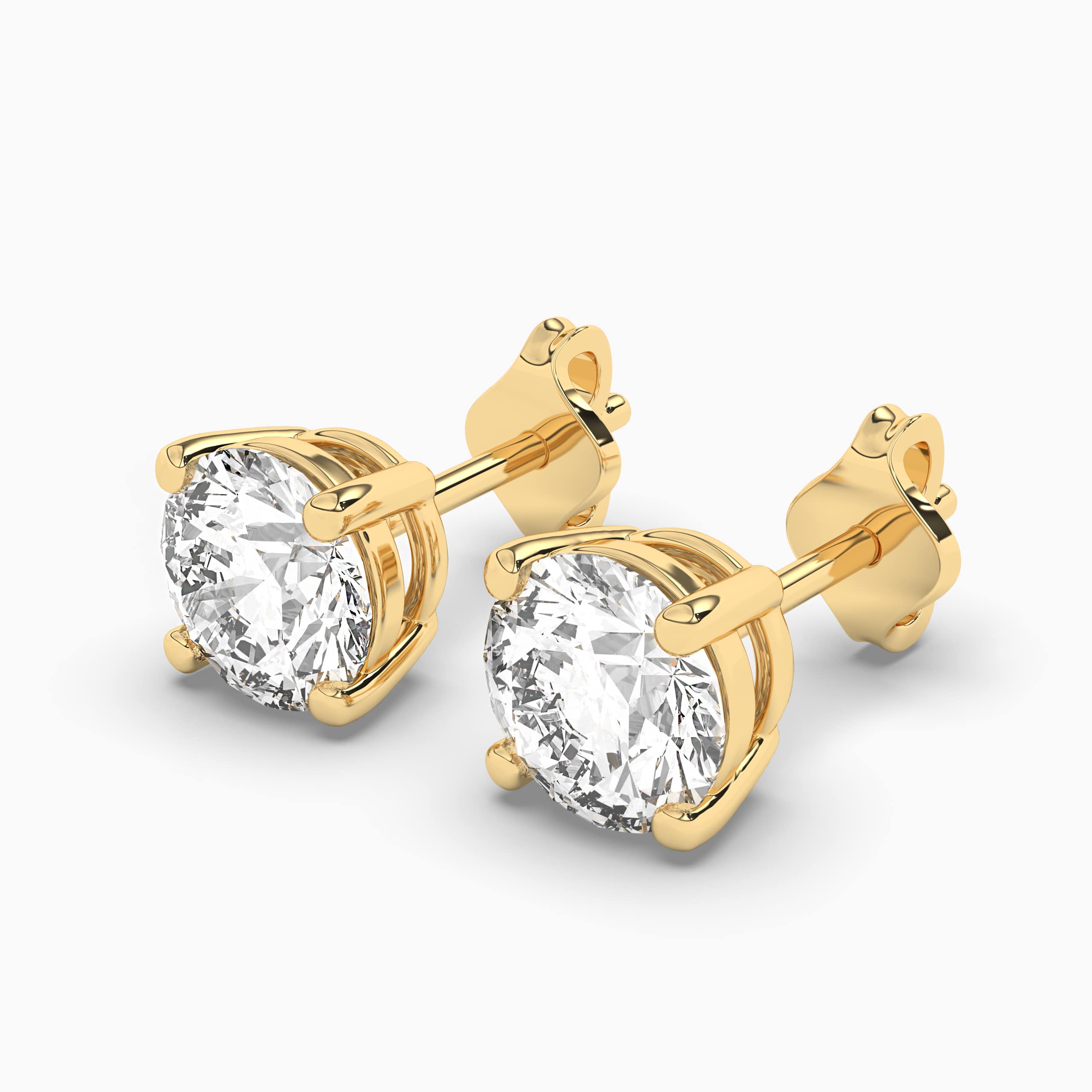 Round Cut Diamond Stud Earrings In Yellow Gold