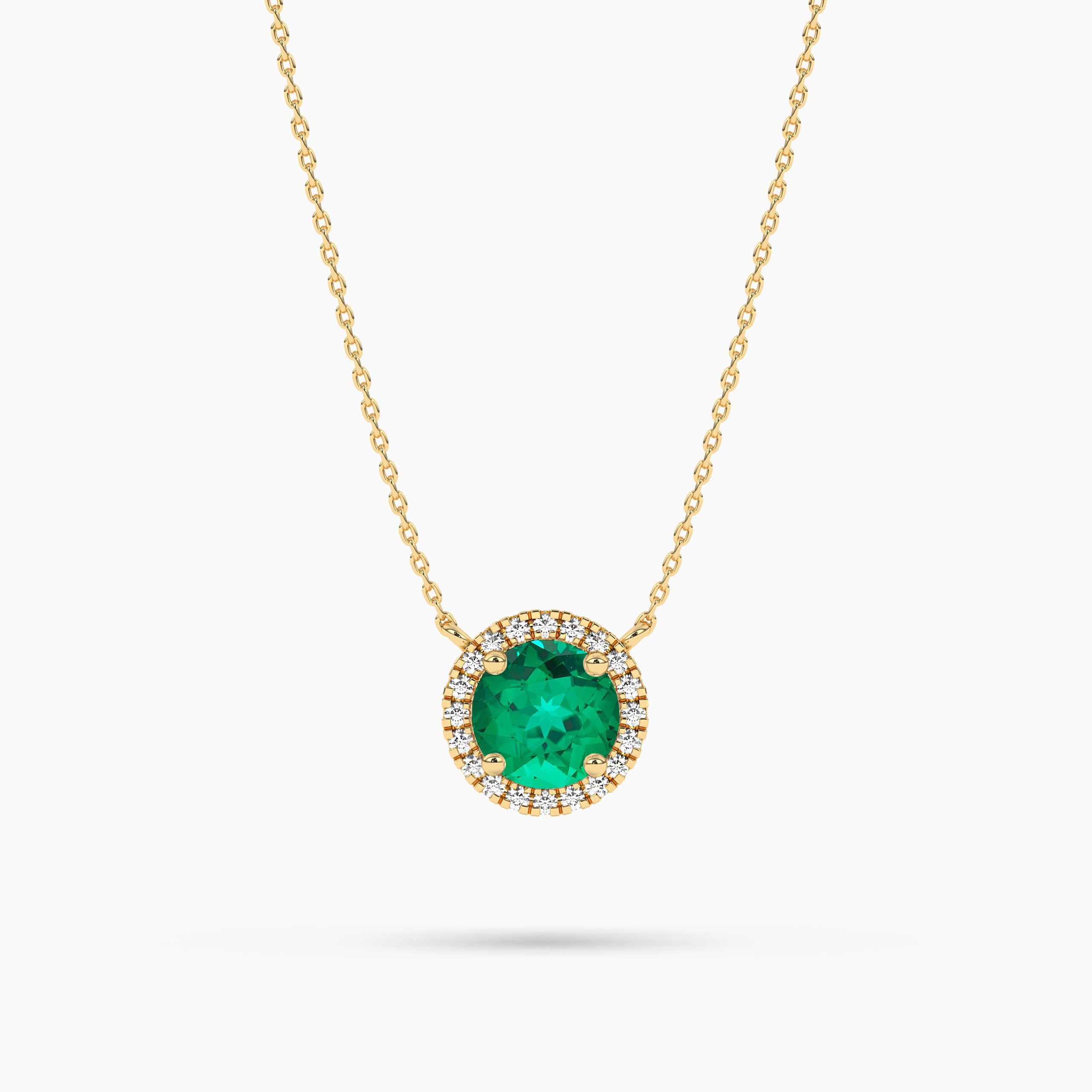 Round Emerald and Diamond Halo Pendant in Yellow Gold