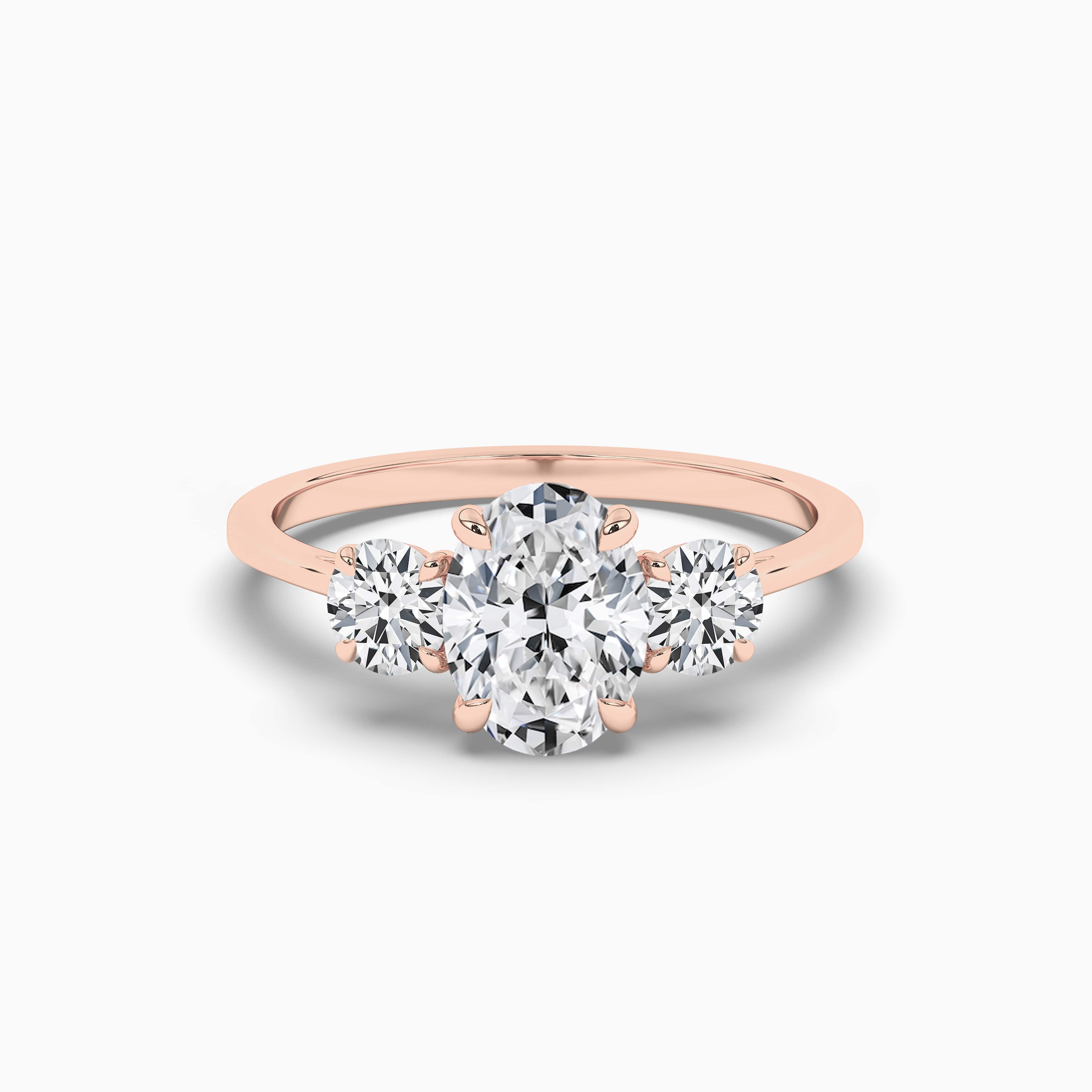 OVAL CUT DIAMOND ENGAGEMENT RING WITH A THREE STONE IN ROSE GOLD