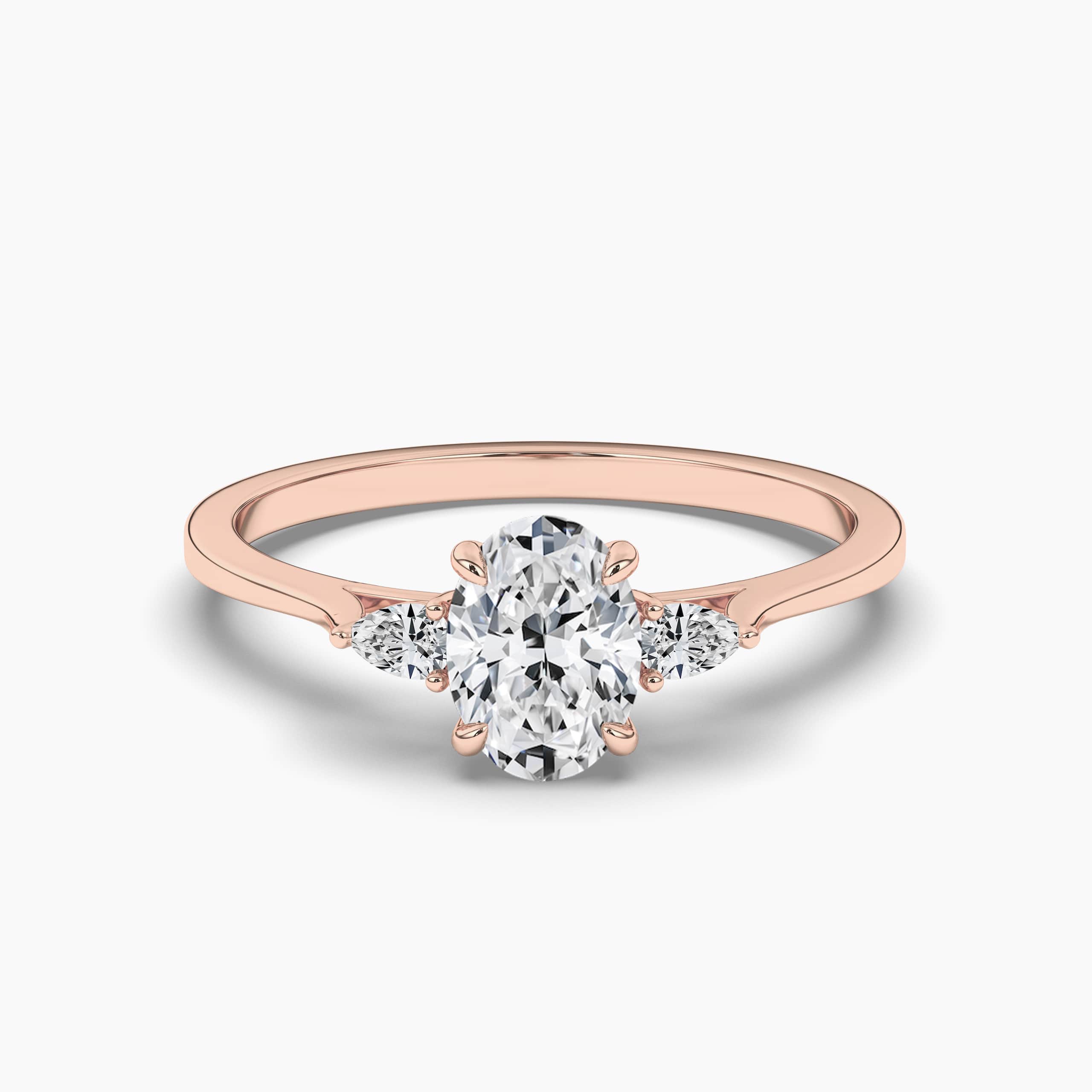 Three Stone Oval Shape Diamond Engagement Ring With Pear Shape Side Stones