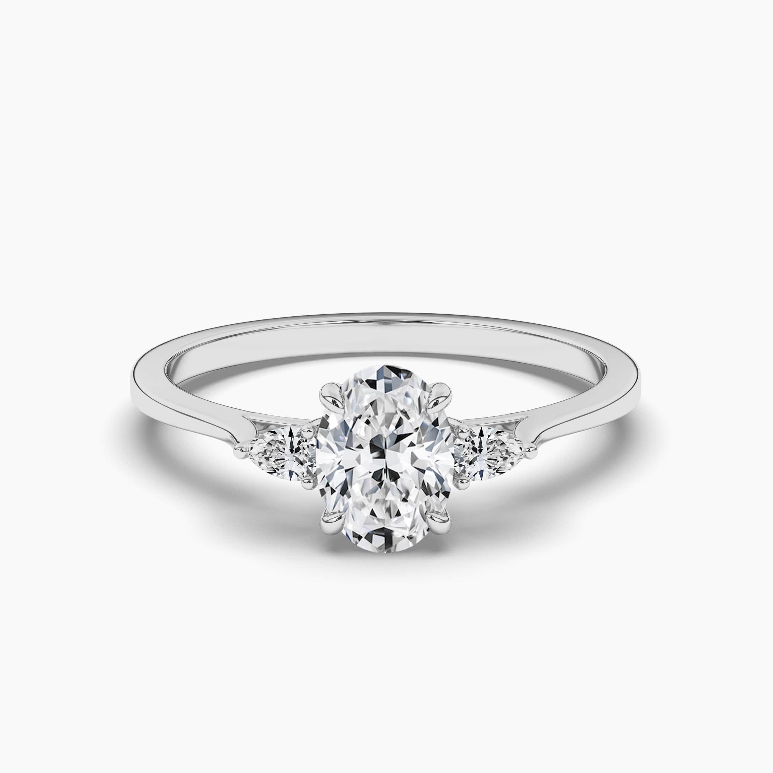 Oval Cut Three Stone Engagement Ring With Pear Side Stones