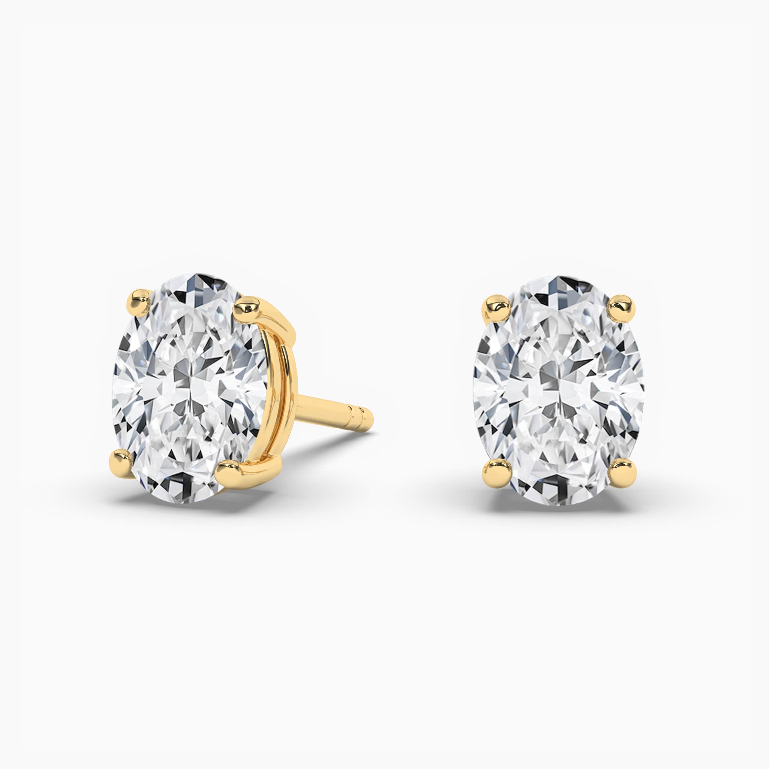Oval Cut Moissanite Solitaire Stud Earrings In Yellow Gold