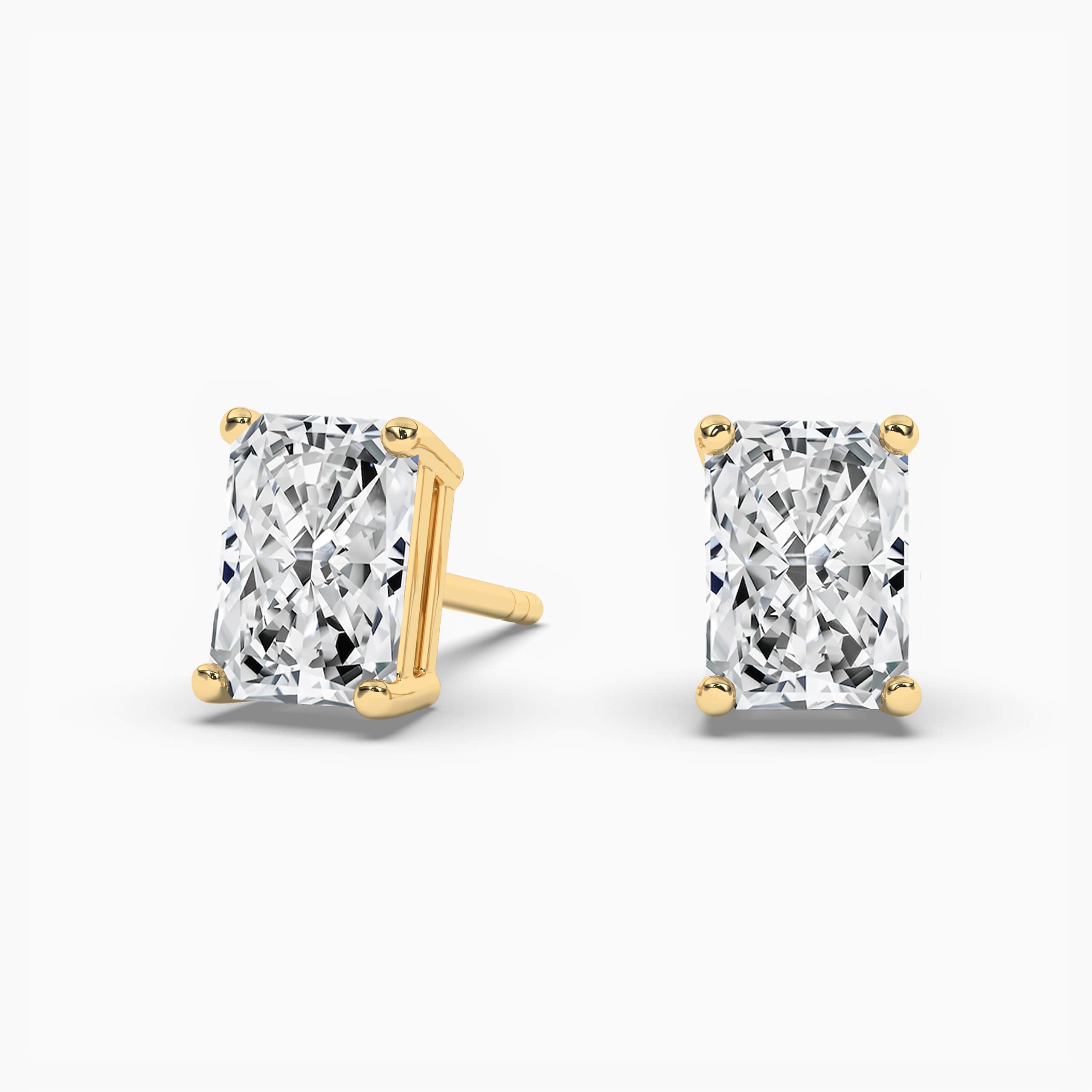 Yellow Diamond Solitaire Stud Earrings in Yellow Gold 