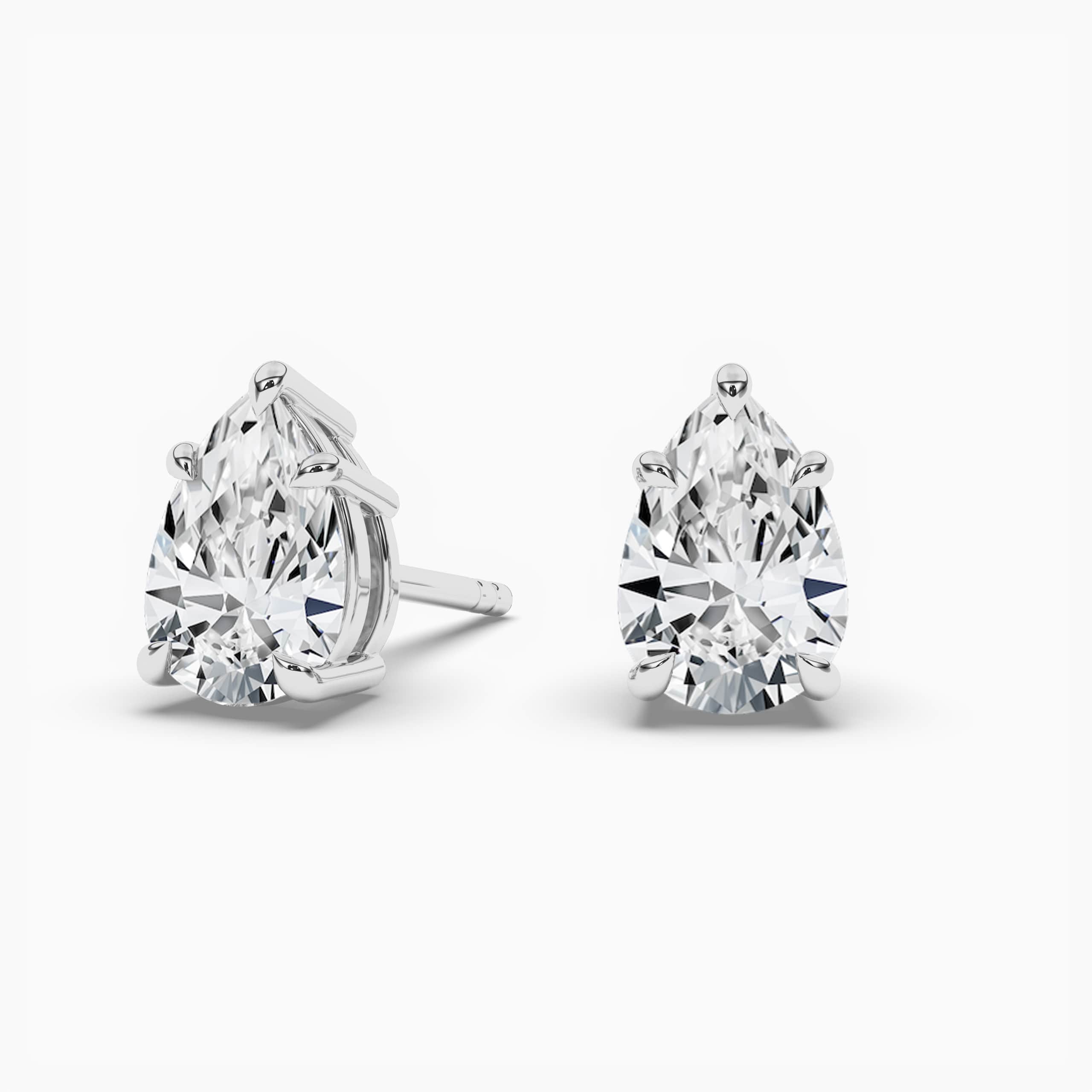 Pear Cut Diamond Solitaire Stud Earrings In White Gold