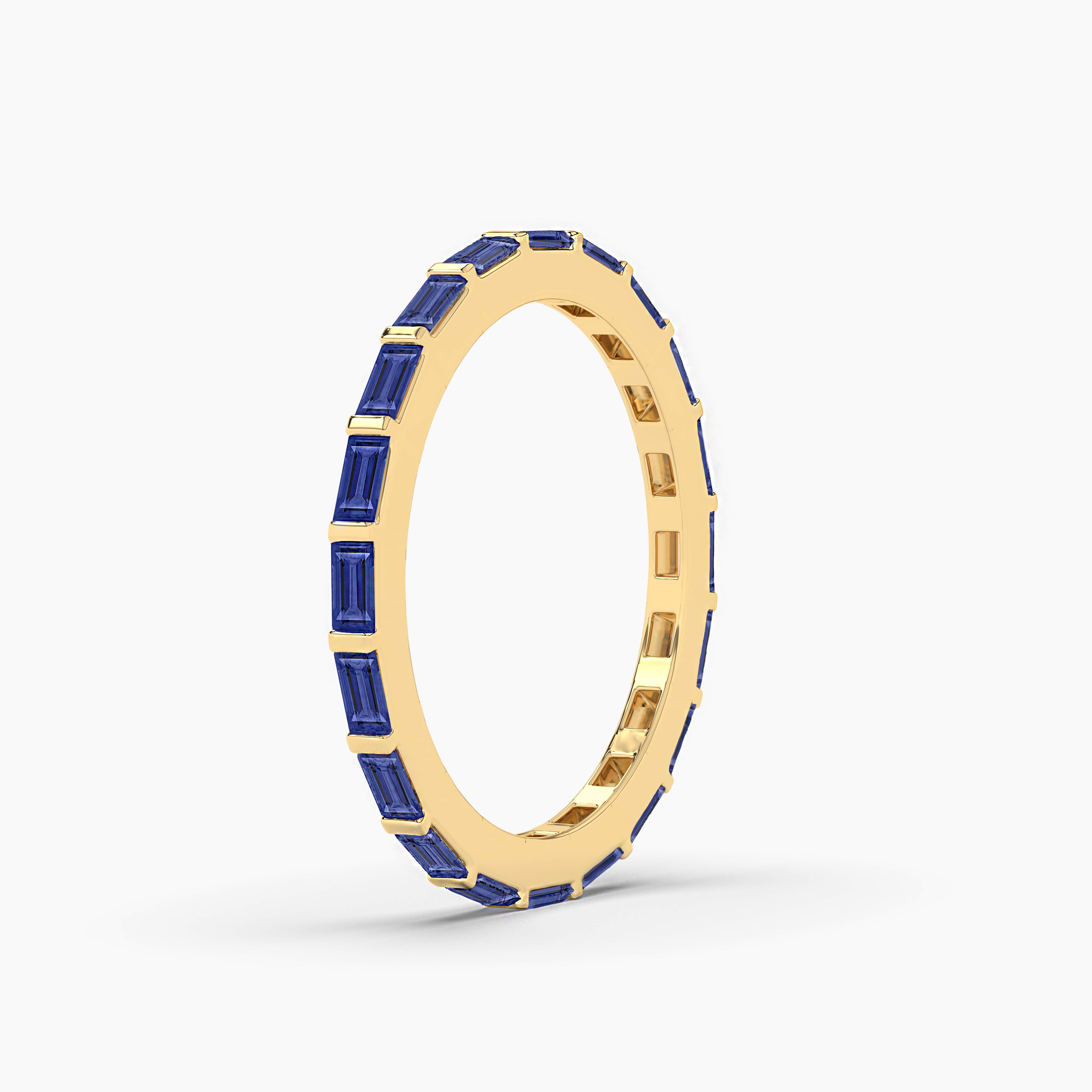 blue sapphire baguette band in yellow gold