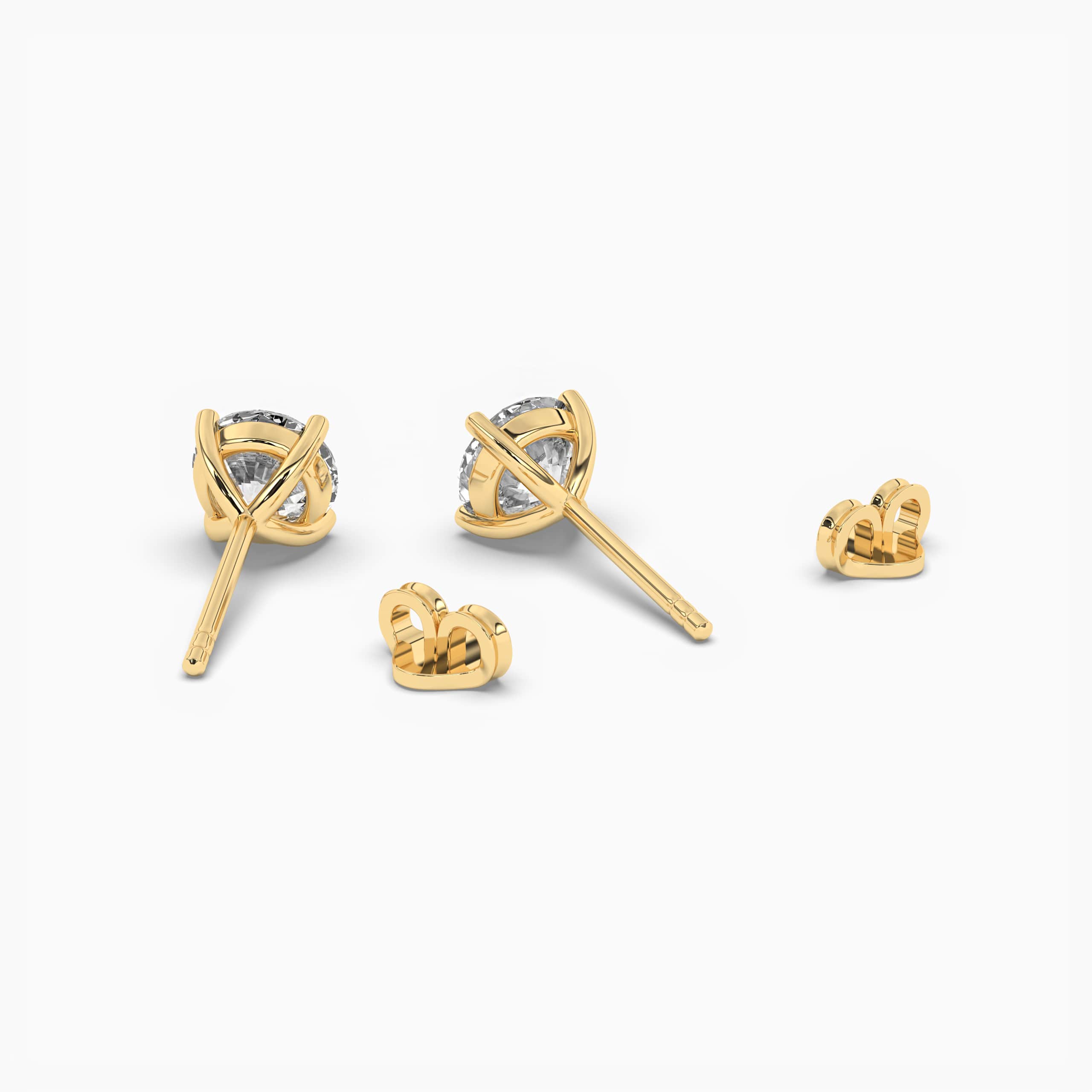 Round Diamond Solitaire Stud Earrings In Yellow Gold