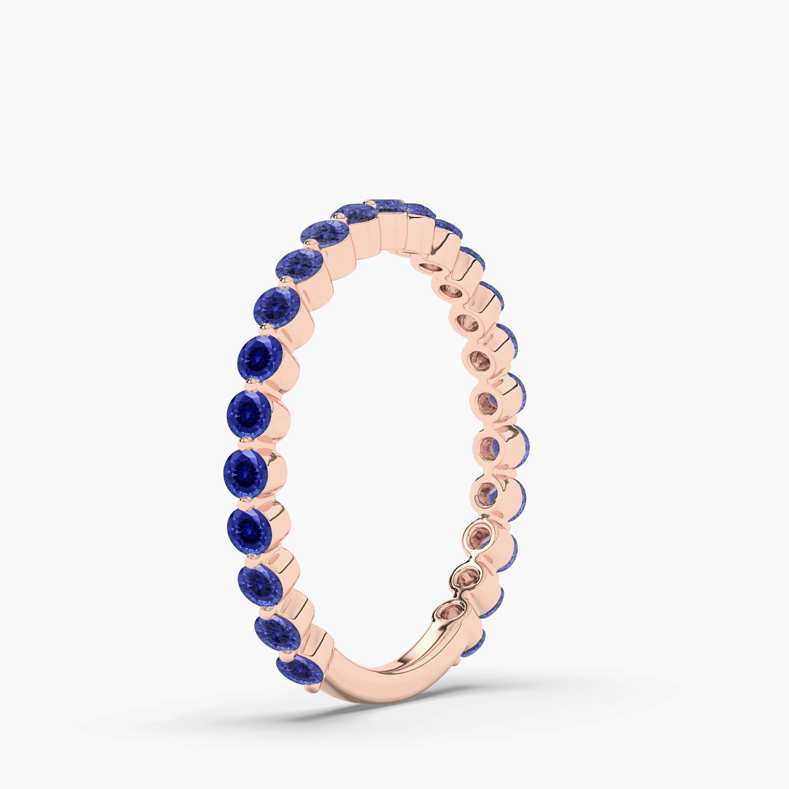 Blue Sapphire Eternity Band In Rose Gold