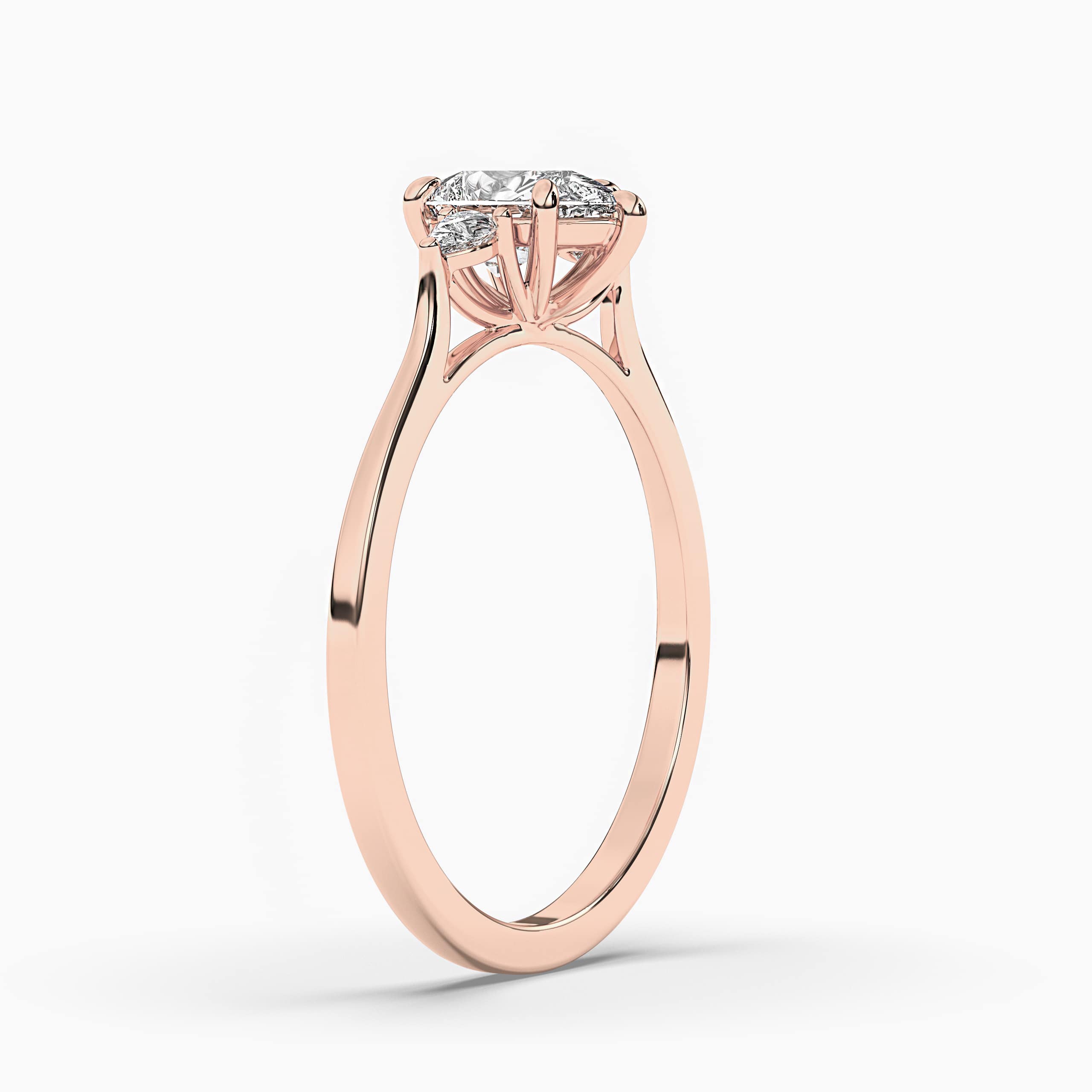EE-STONE ENGAGEMENT RING SET IN ROSE GOLD WITH PEAR CUT SIDE STONES