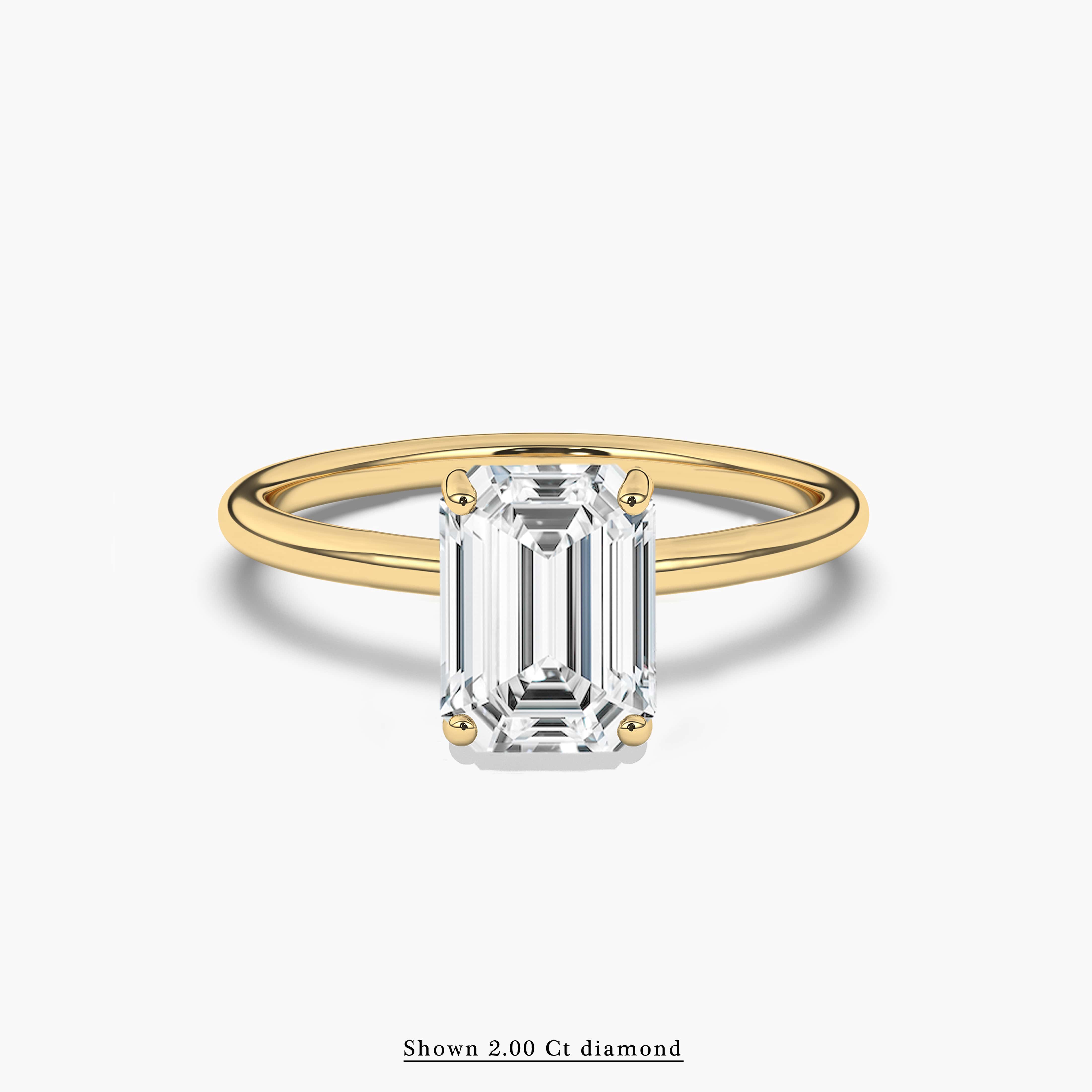 2 carat emerald cut ring with gold band