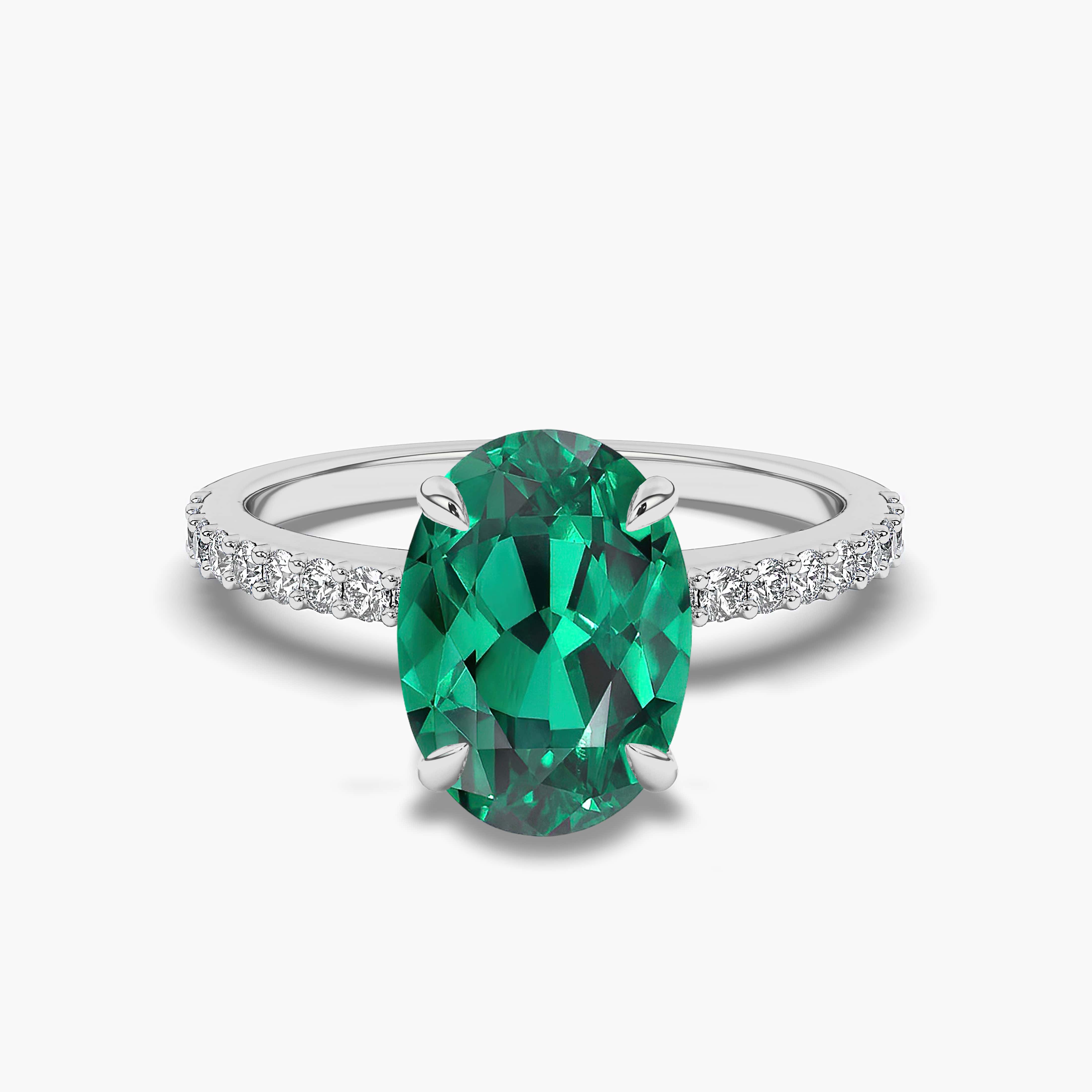 Oval Shaped diamond Side Stone Engagement Rings with  Emerald in White Gold