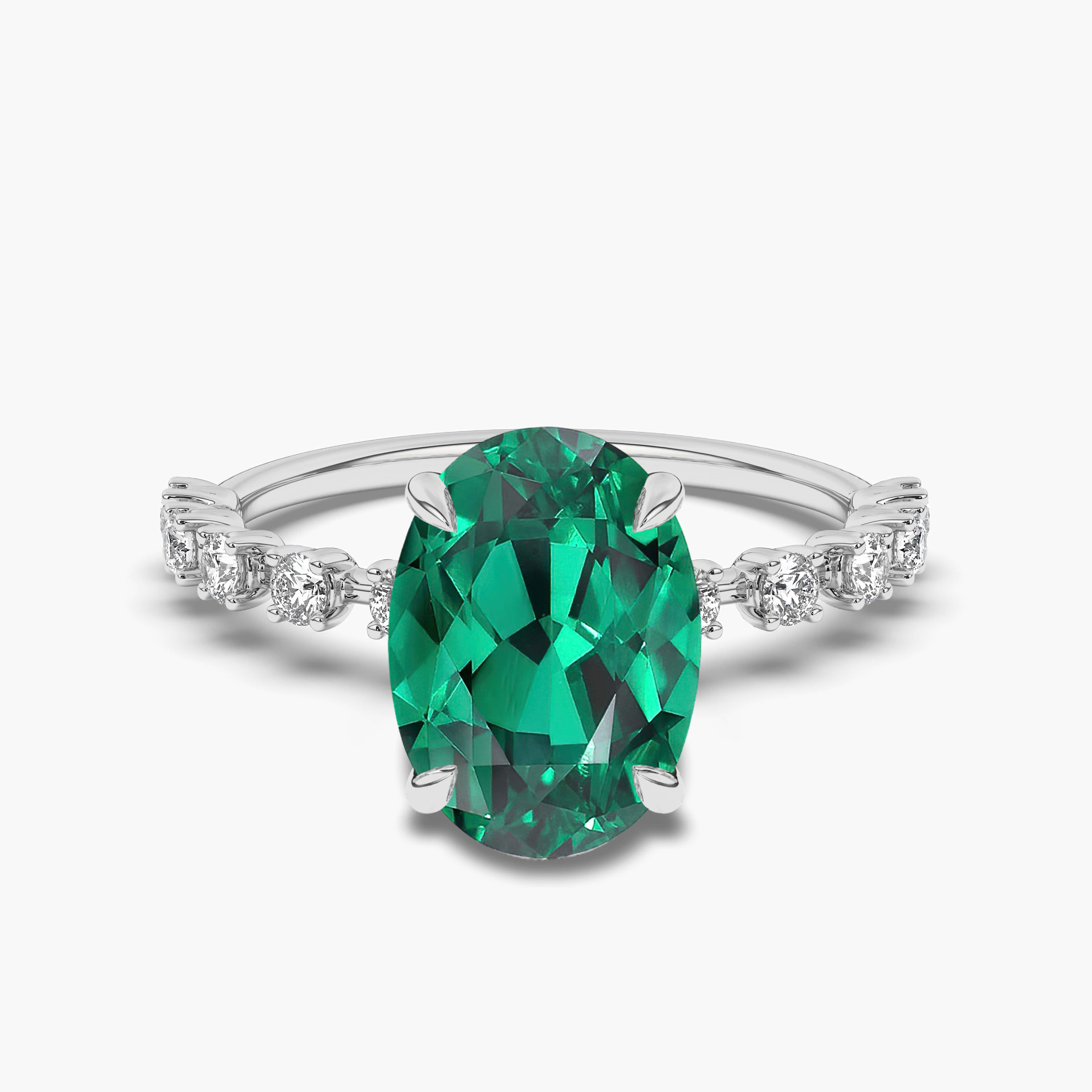 WHITE GOLD OVAL EMERALD AND DIAMOND RING