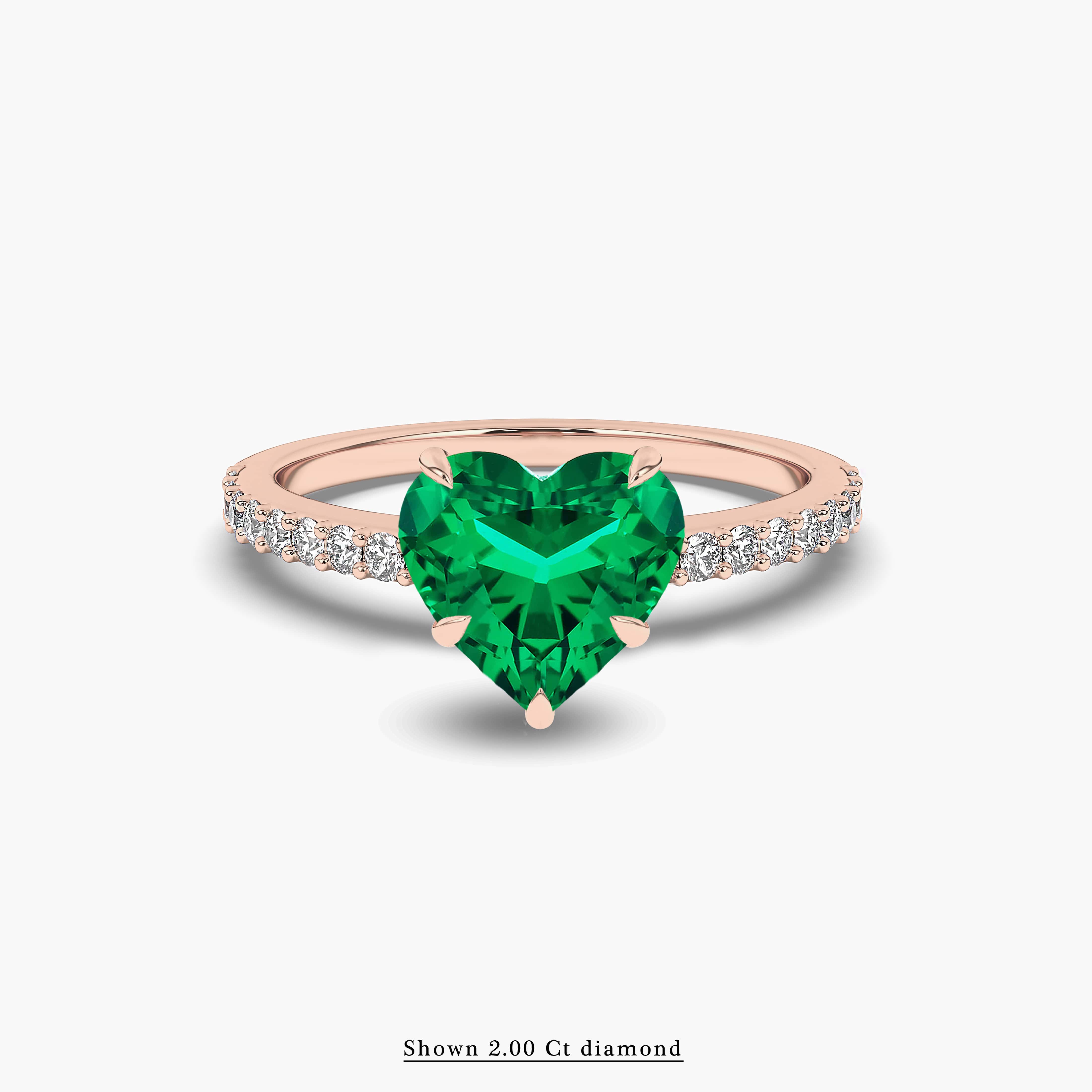 rose gold emerald diamond side stones ring