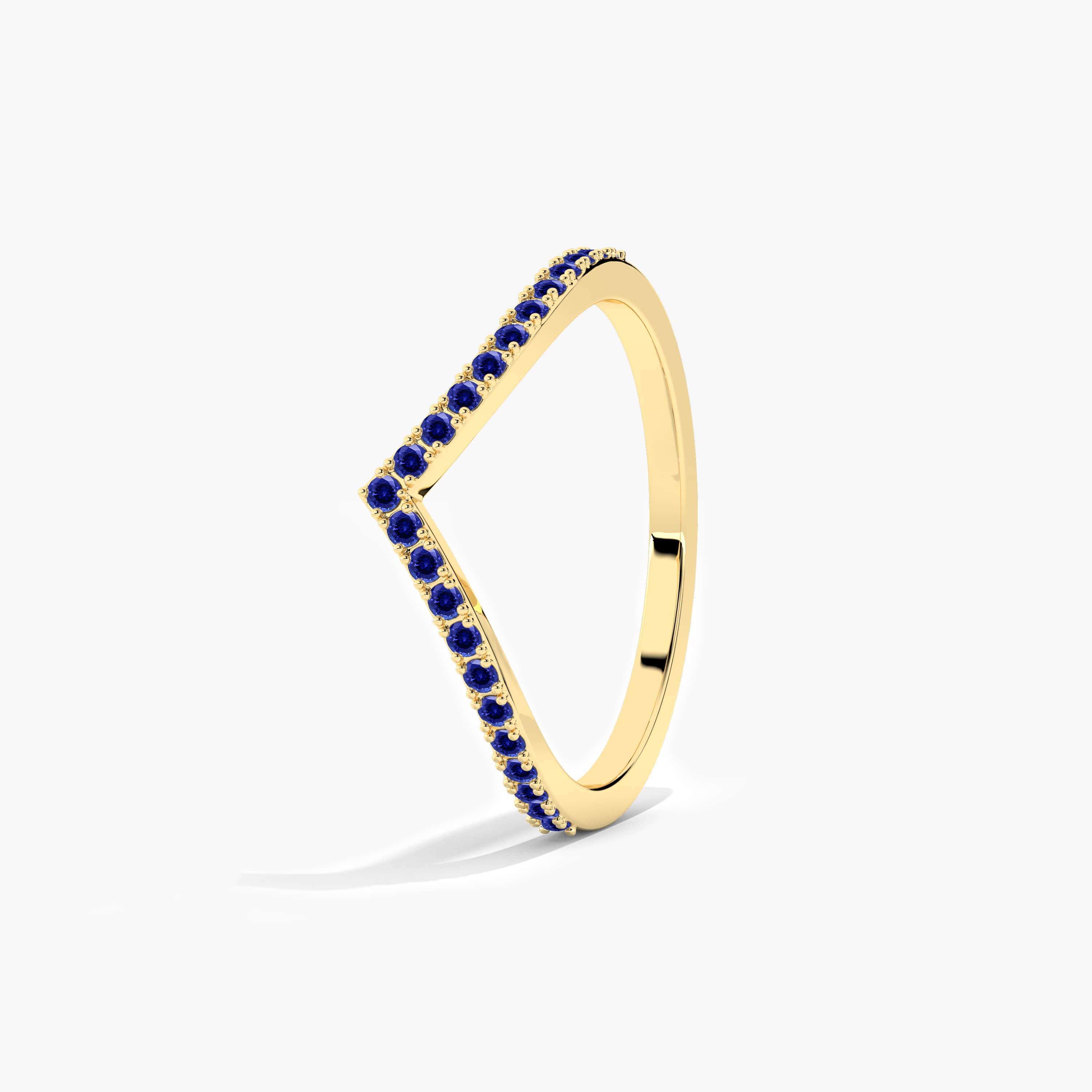yellow gold curved ring in blue sapphire 