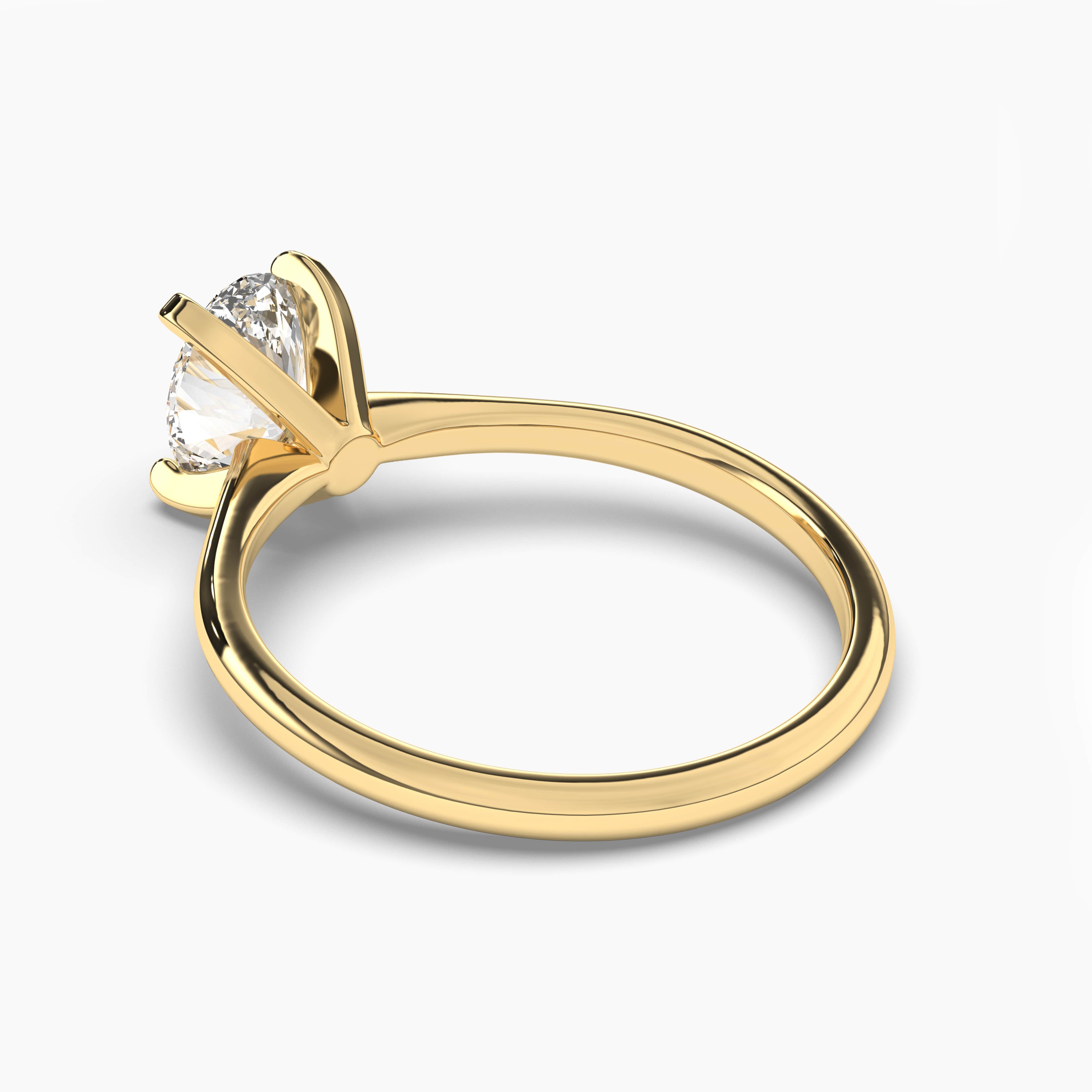 Oval diamond solitaire engagement ring set in yellow gold