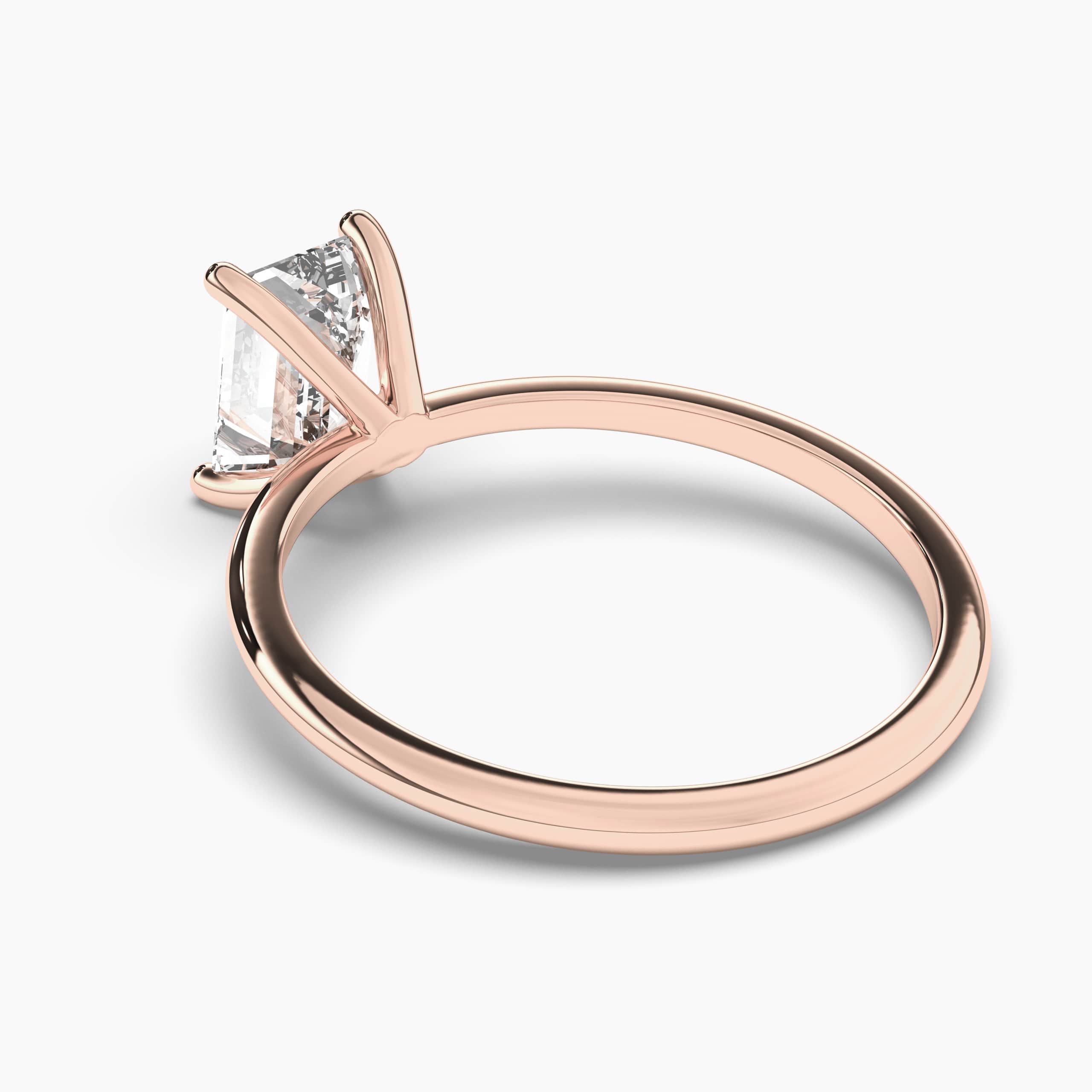 Emerald diamond four-claw solitaire engagement ring set in rose gold