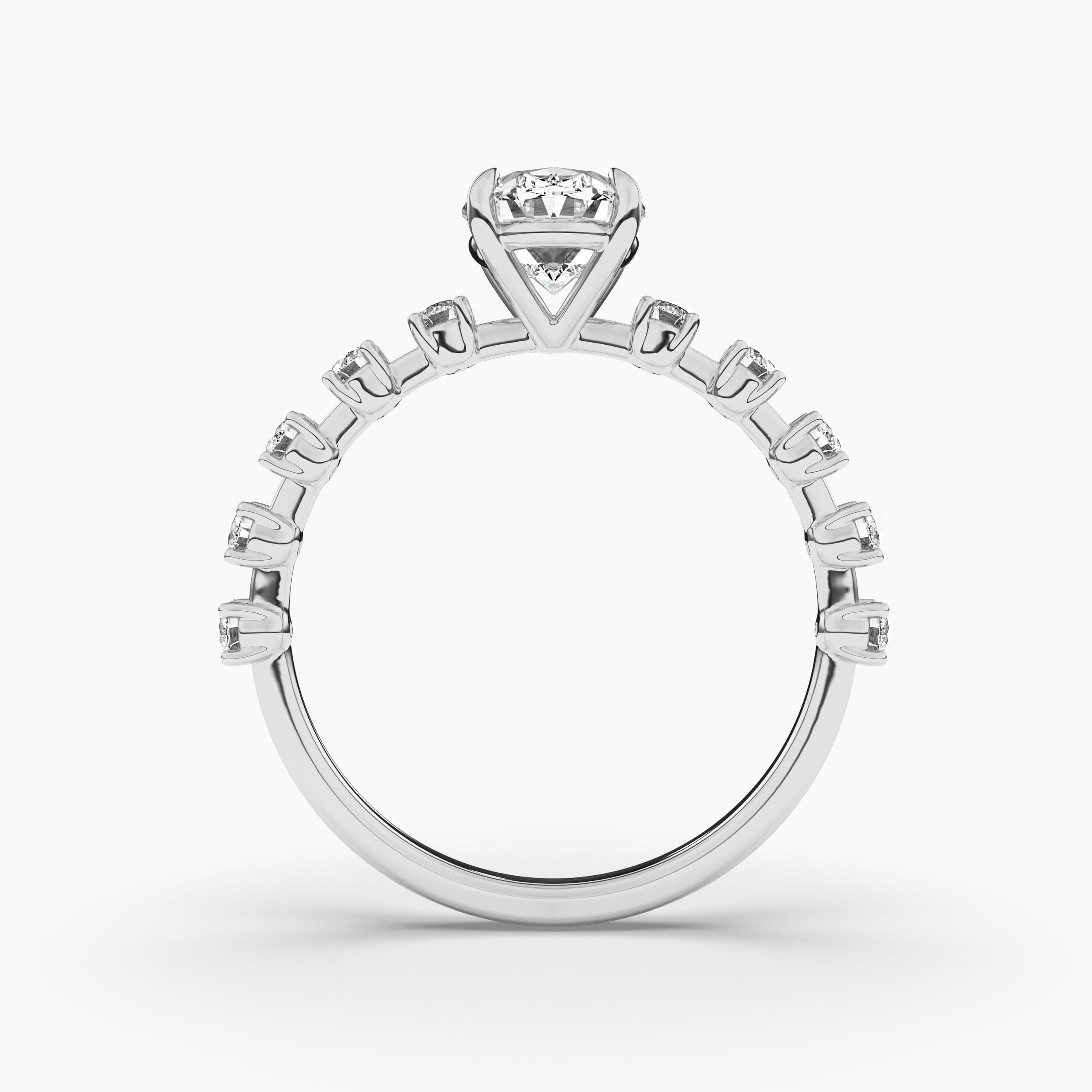 gold wedding ring with oval diamond in white gold