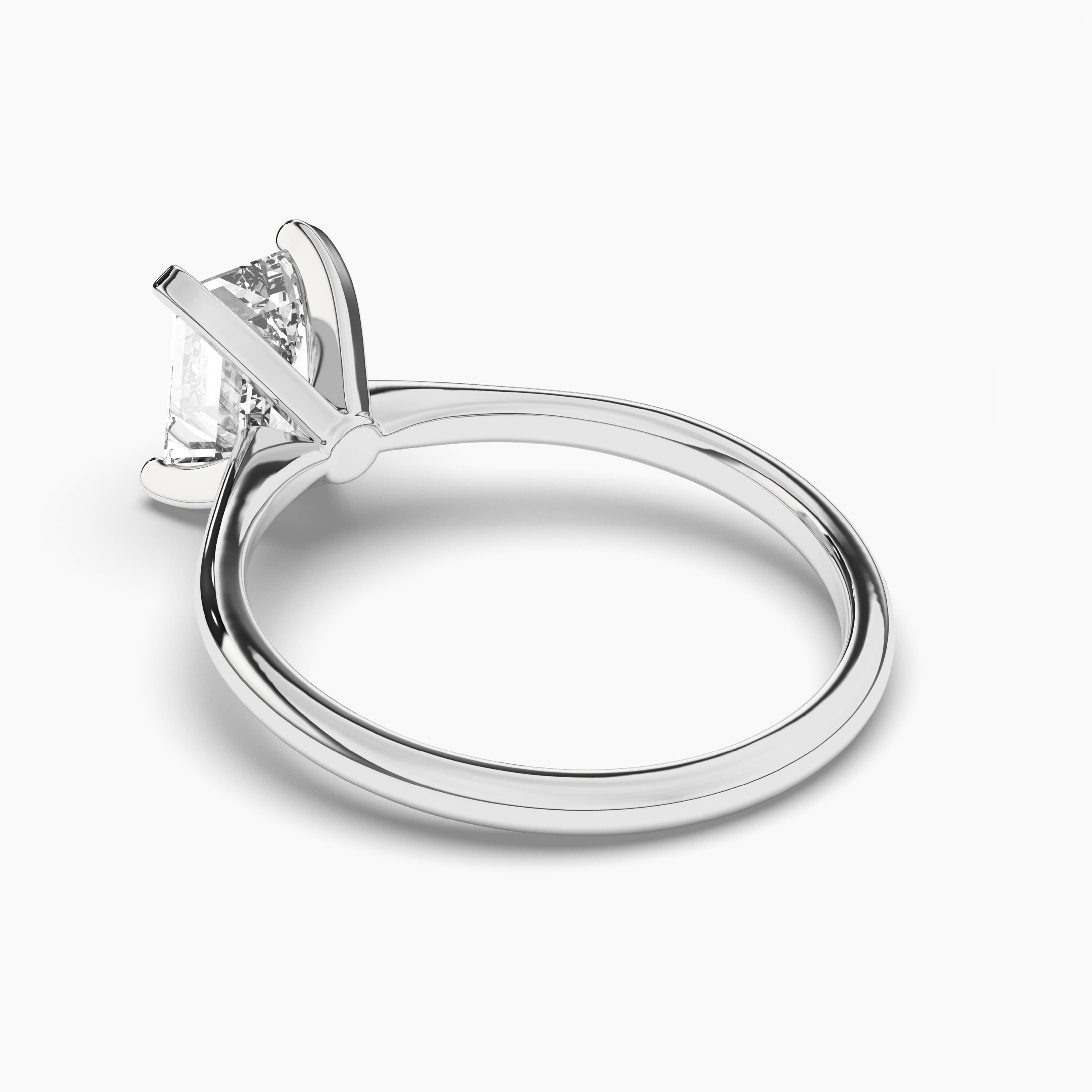 Emerald Cut Solitaire Engagement Ring In White Gold