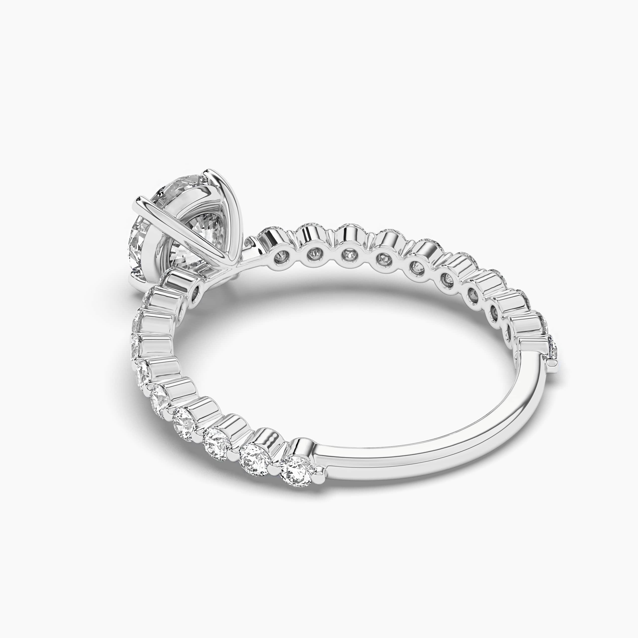 Round Cut Engagement Ring With Moissanite Side Stone In White Gold