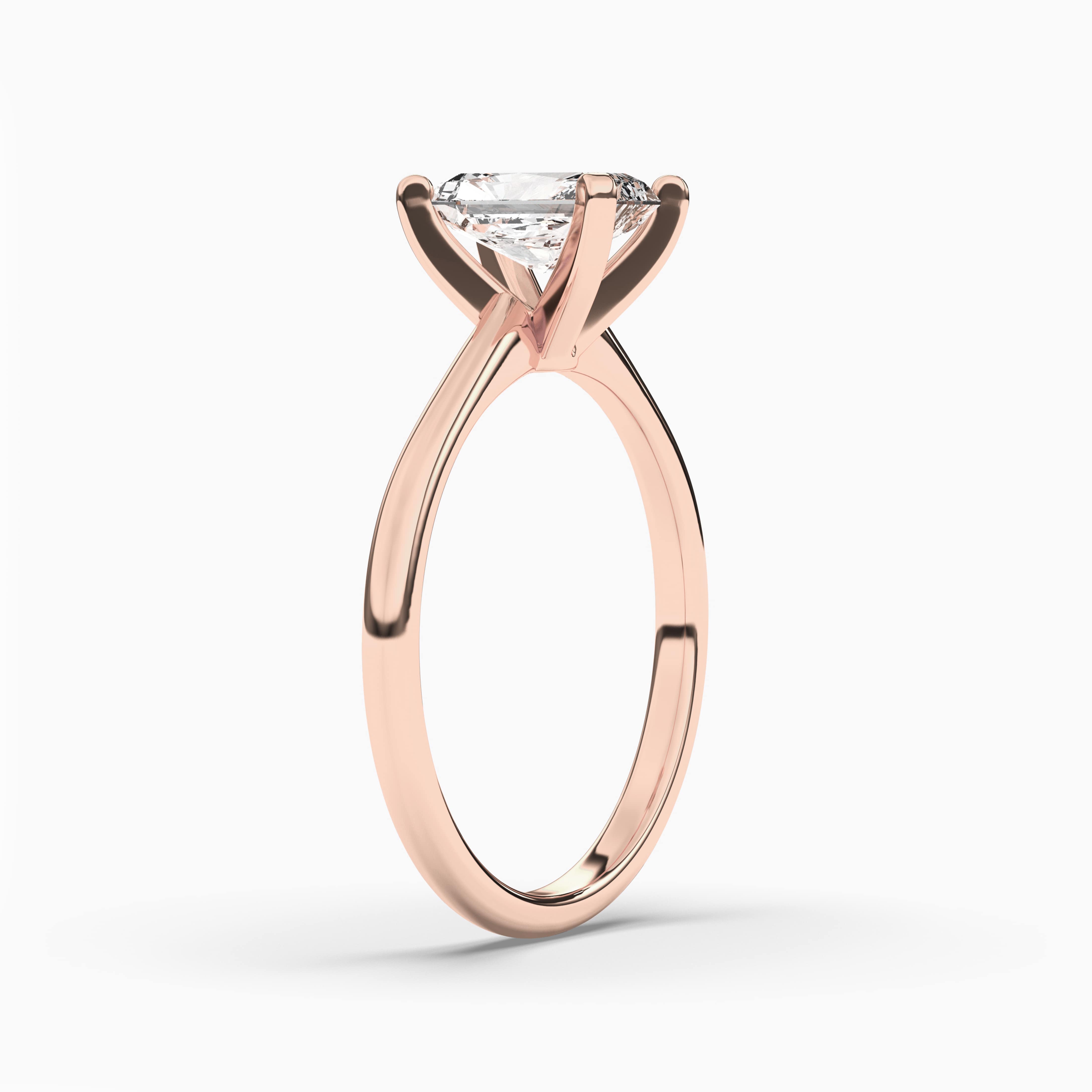 ROSE GOLD RADIANT CUT DIAMOND RING WITH CUT SIDE STONES