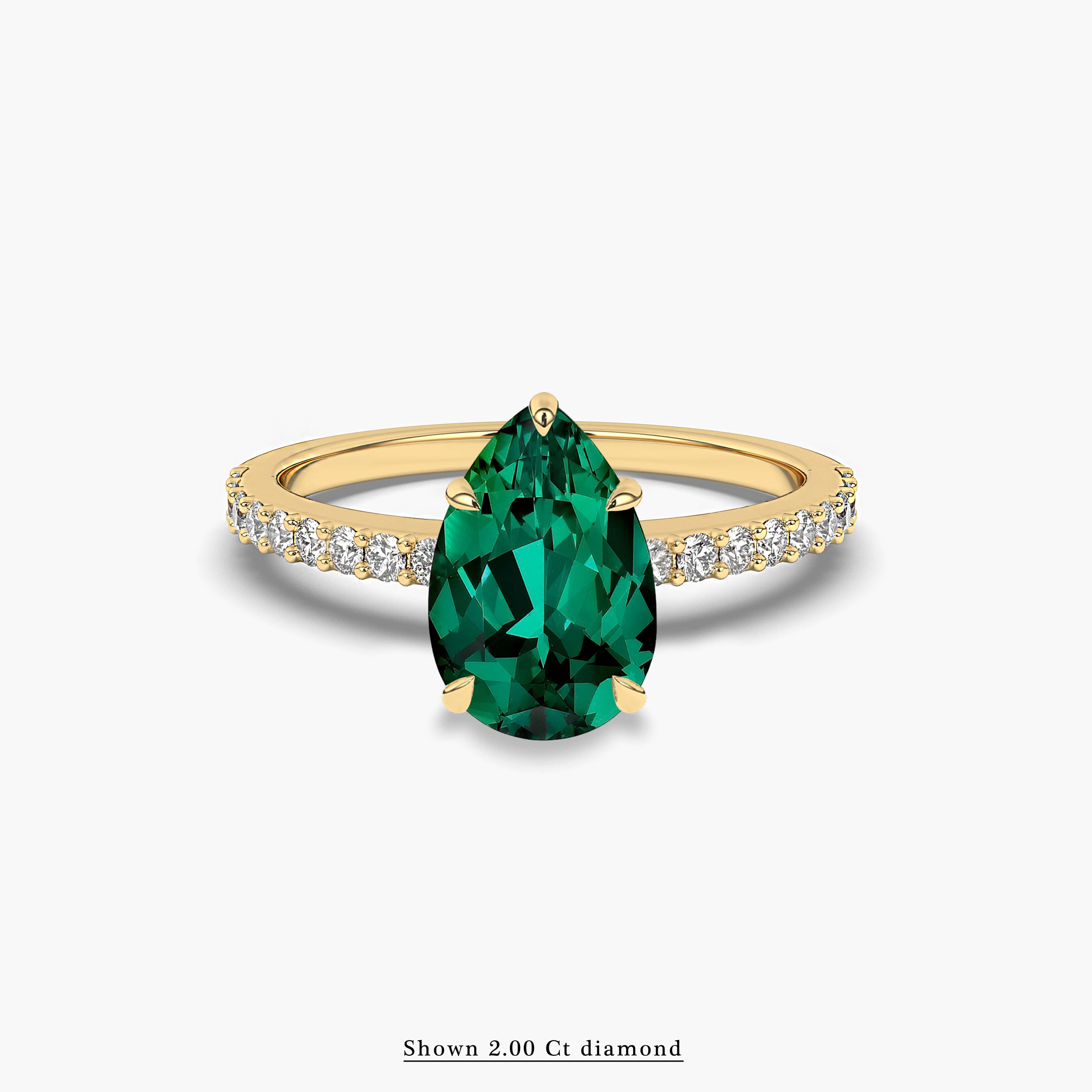 green emerald and diamond side stones ring 