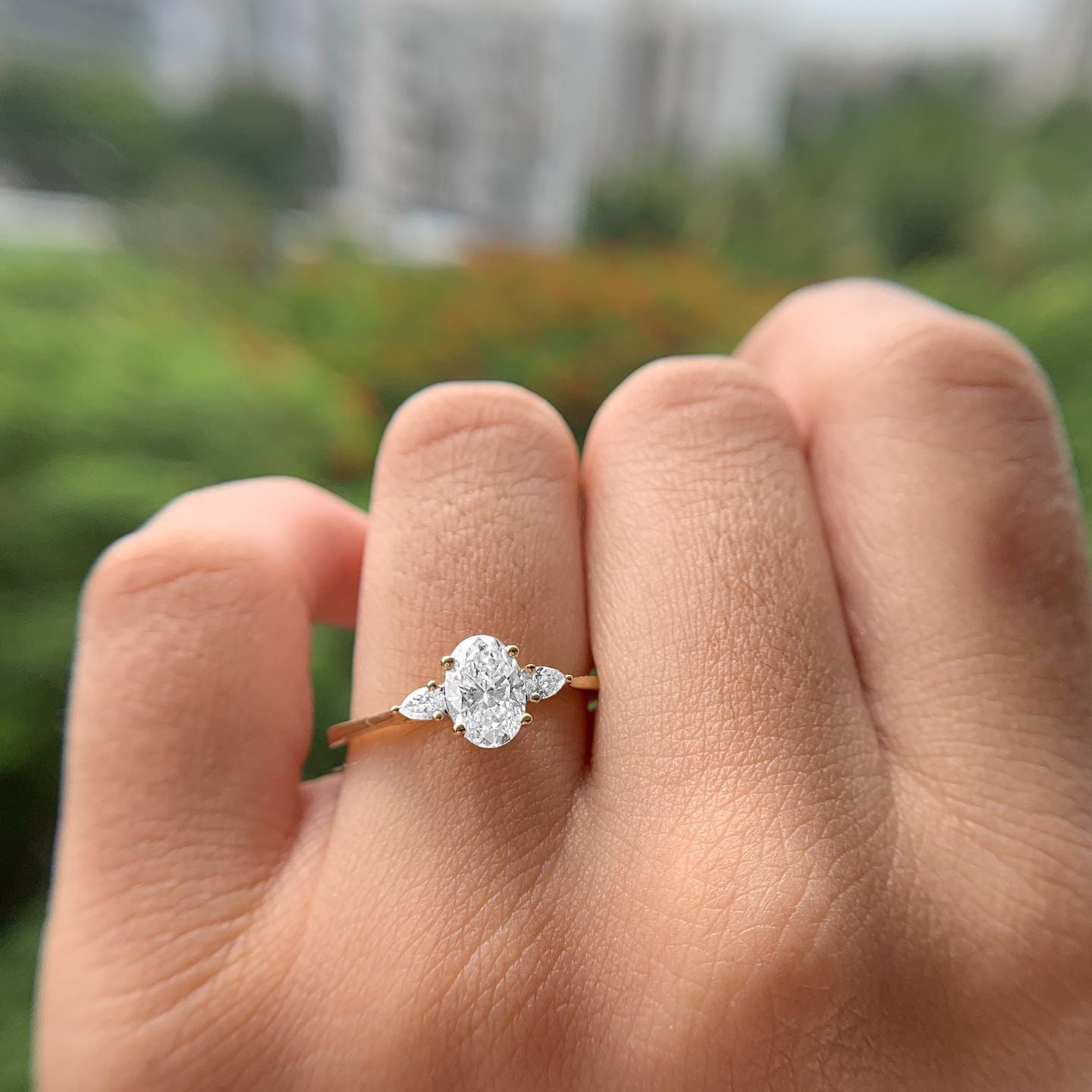 THREE STONE ENGAGEMENT RING WITH OVAL DIAMONDS