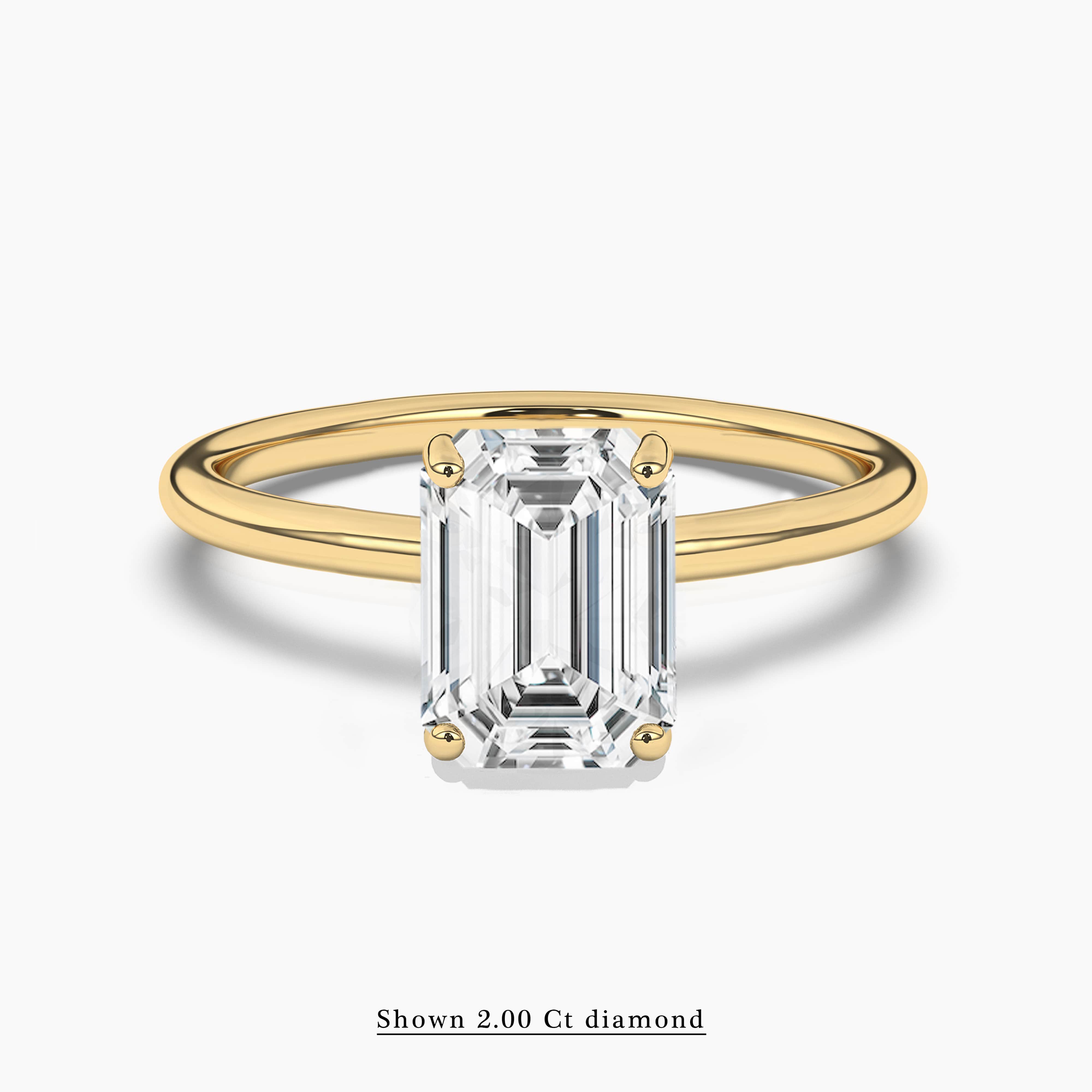2 carat emerald cut ring with gold band