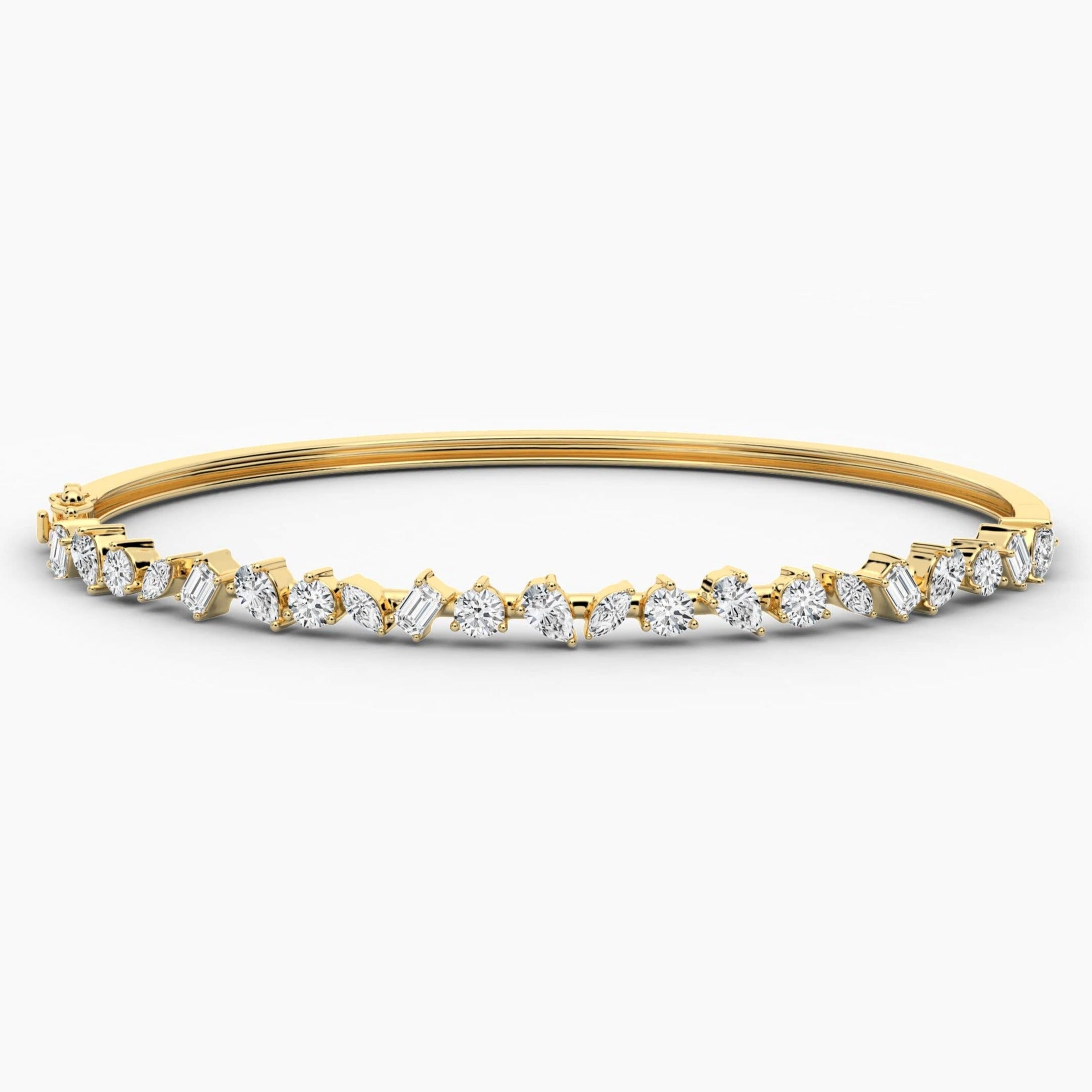 gold and diamond bangle bracelet in yellow gold