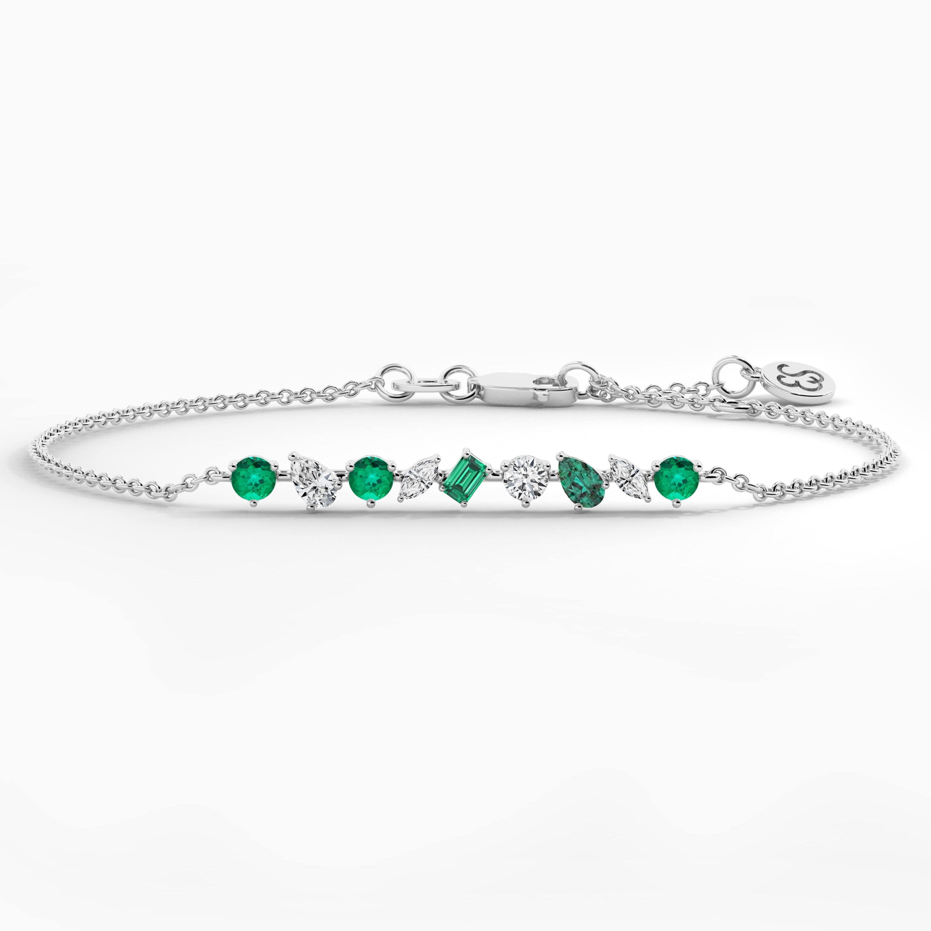 multi shape emerald and white diamond bracelet in white gold 