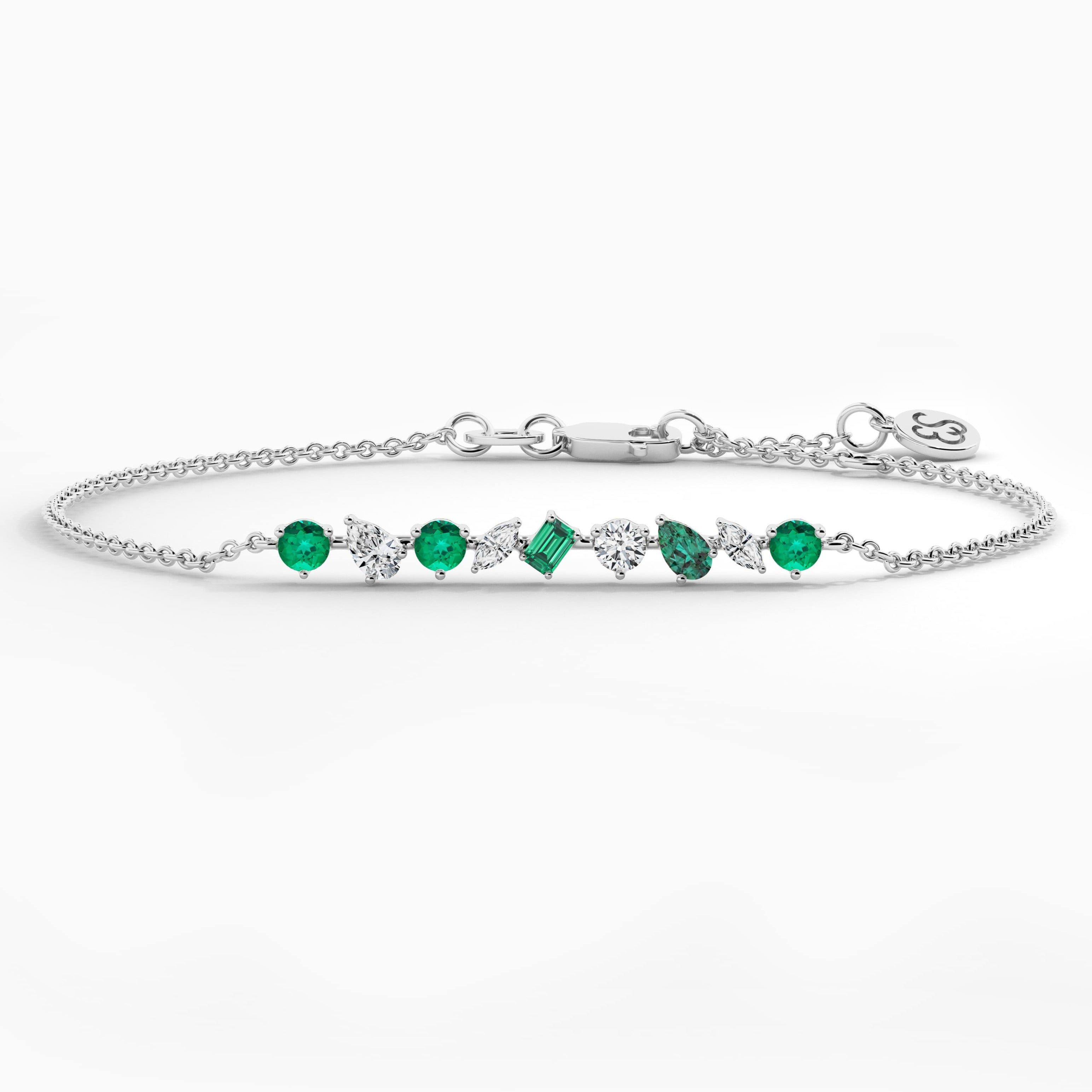 multi shape emerald and white diamond bracelet in white gold 