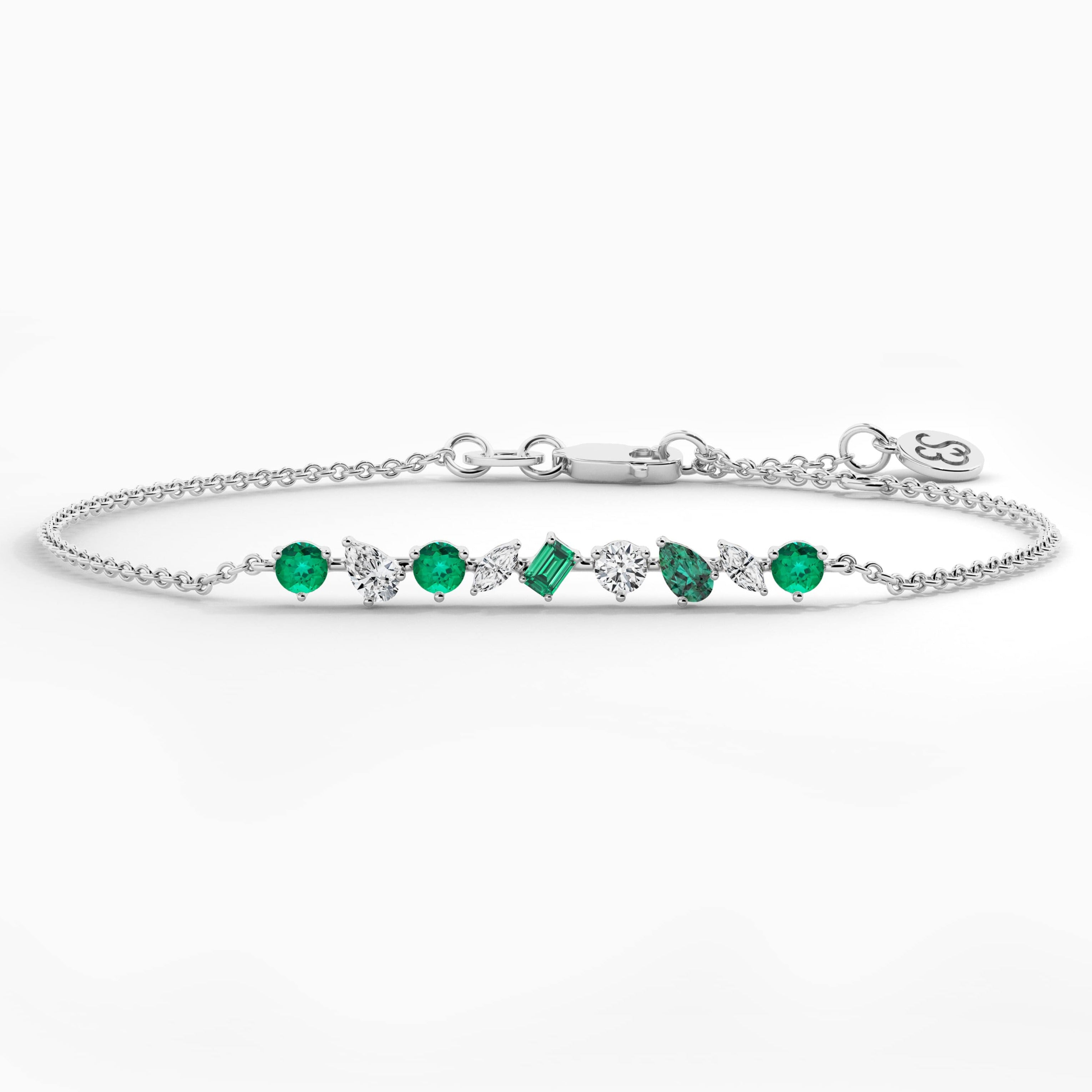 multi shape emerald and white diamond bracelet in white gold 