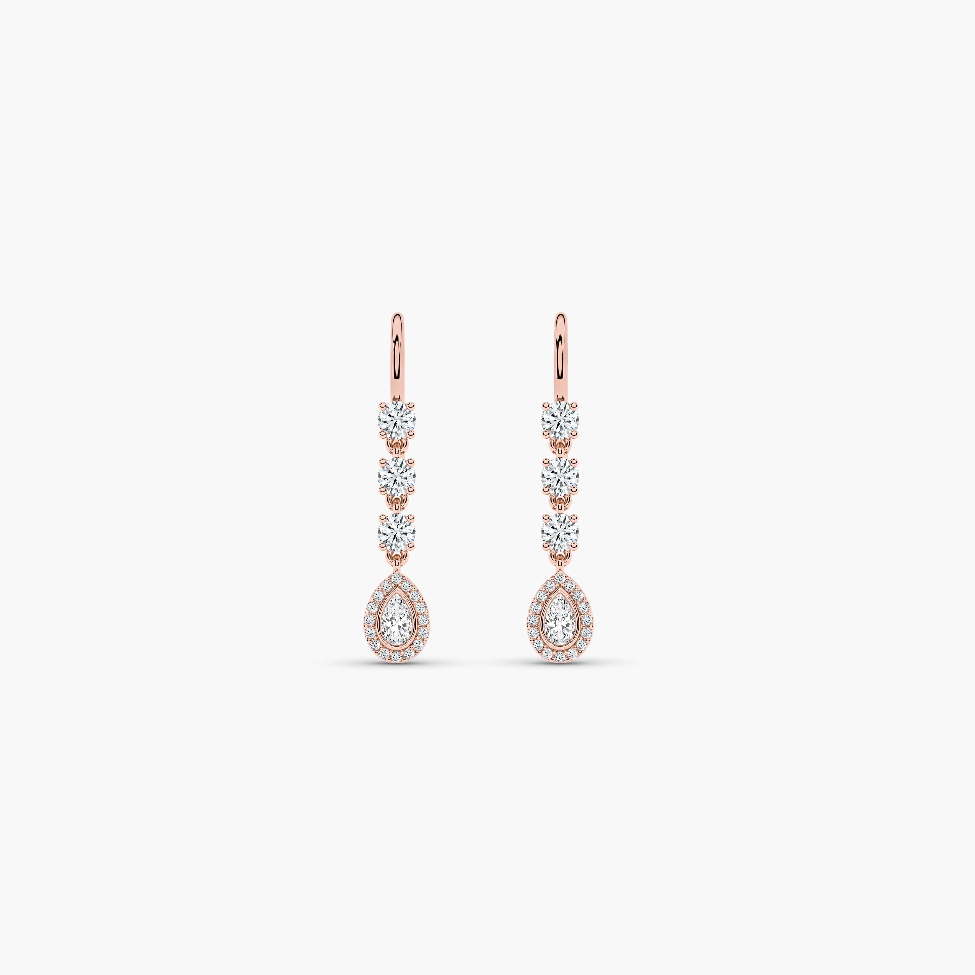 a pair of gold and diamond earrings​