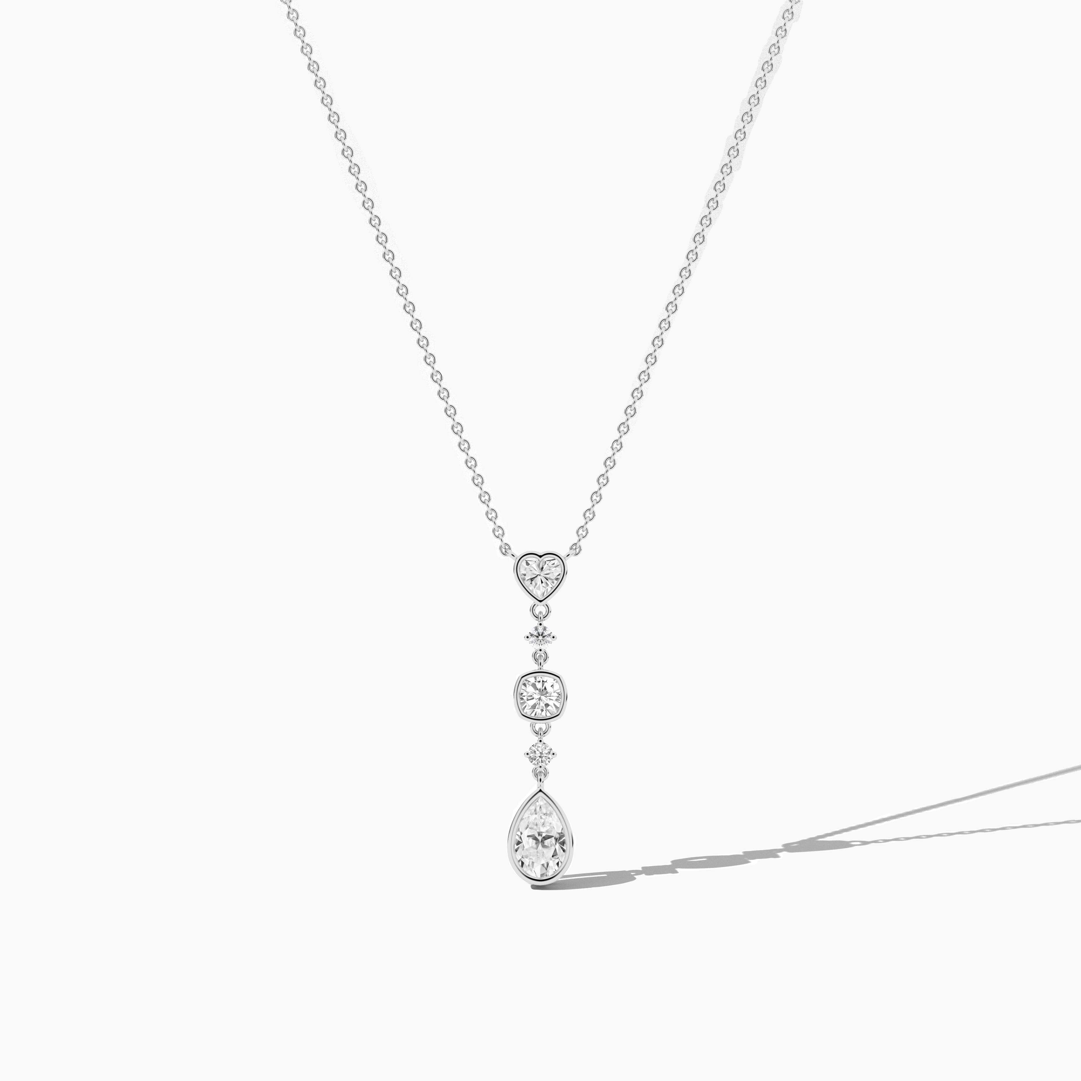 white gold diamond necklace with heart and cushion diamond