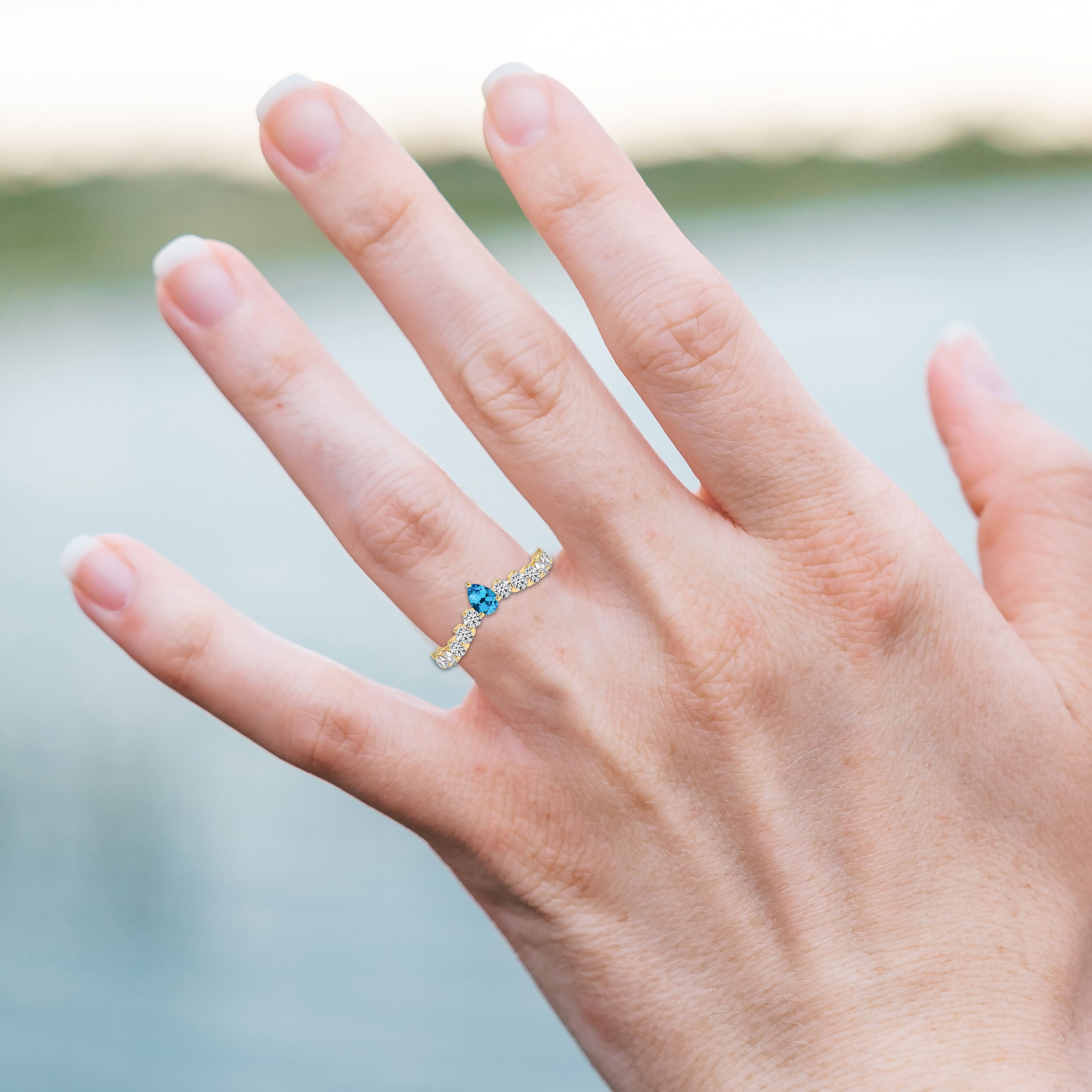 Pear Shaped Blue Topaz Ring with Diamond Set Shoulders