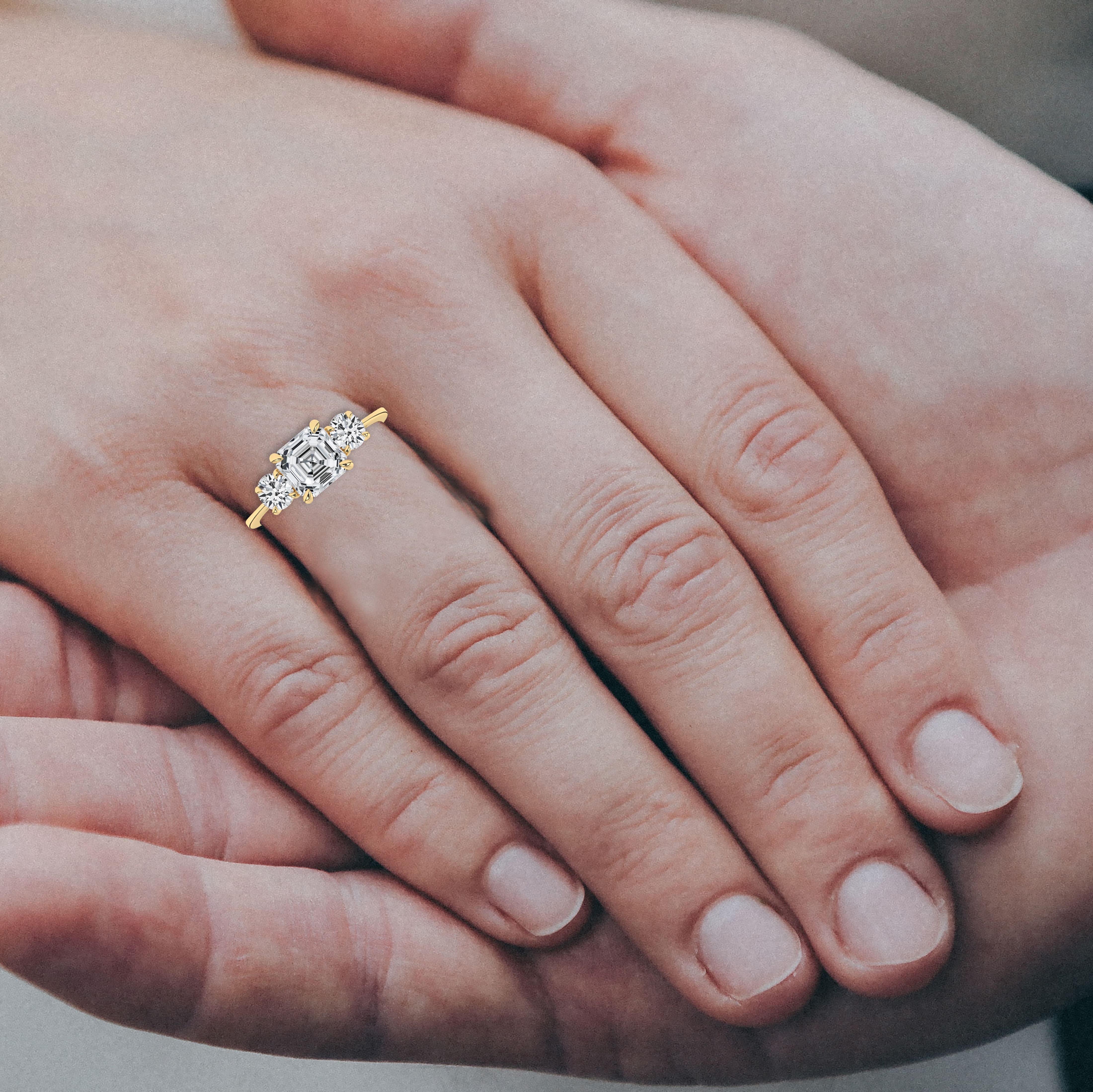 Asschre cut diamond engagement ring on hand 