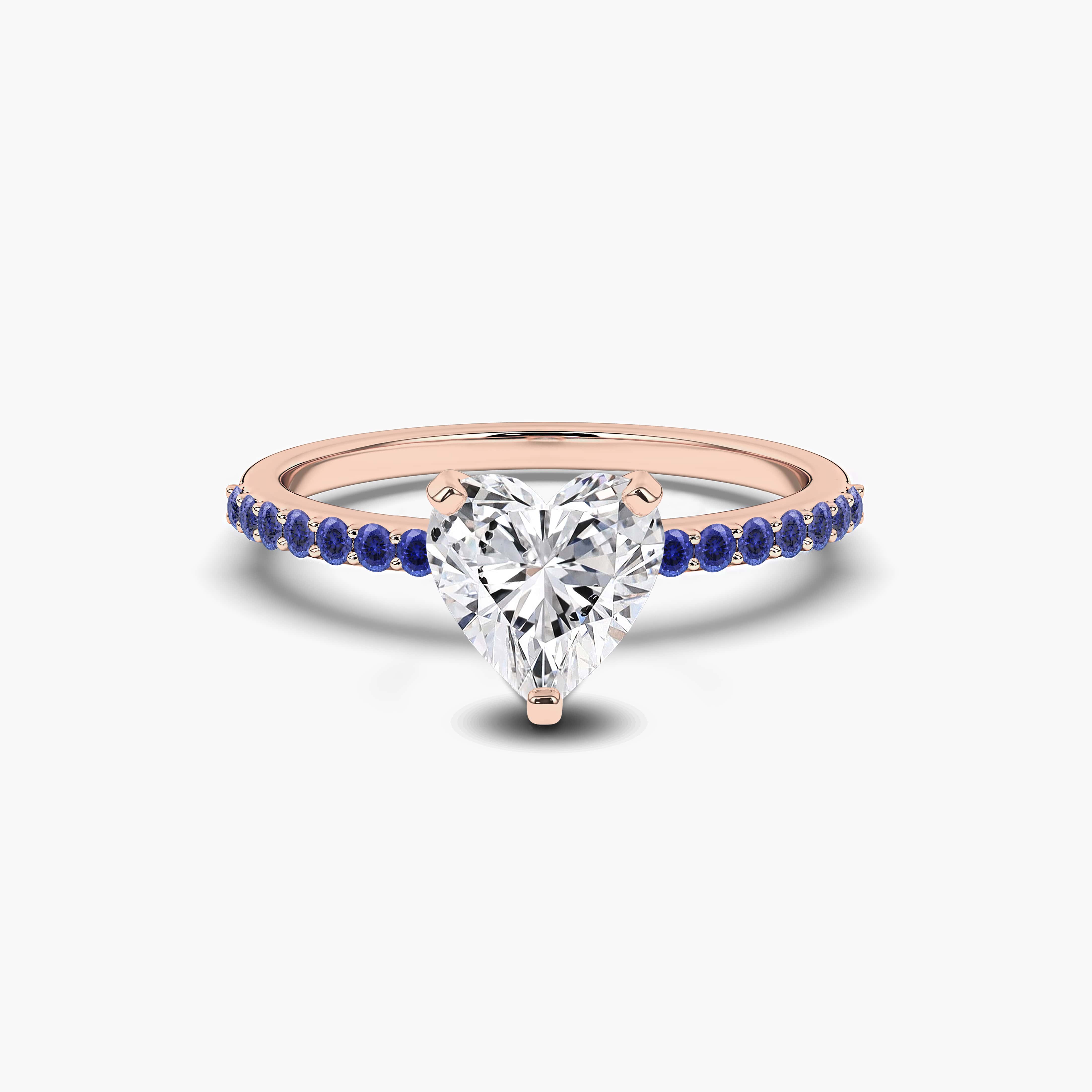 rose gold blue sapphire side stone ring 