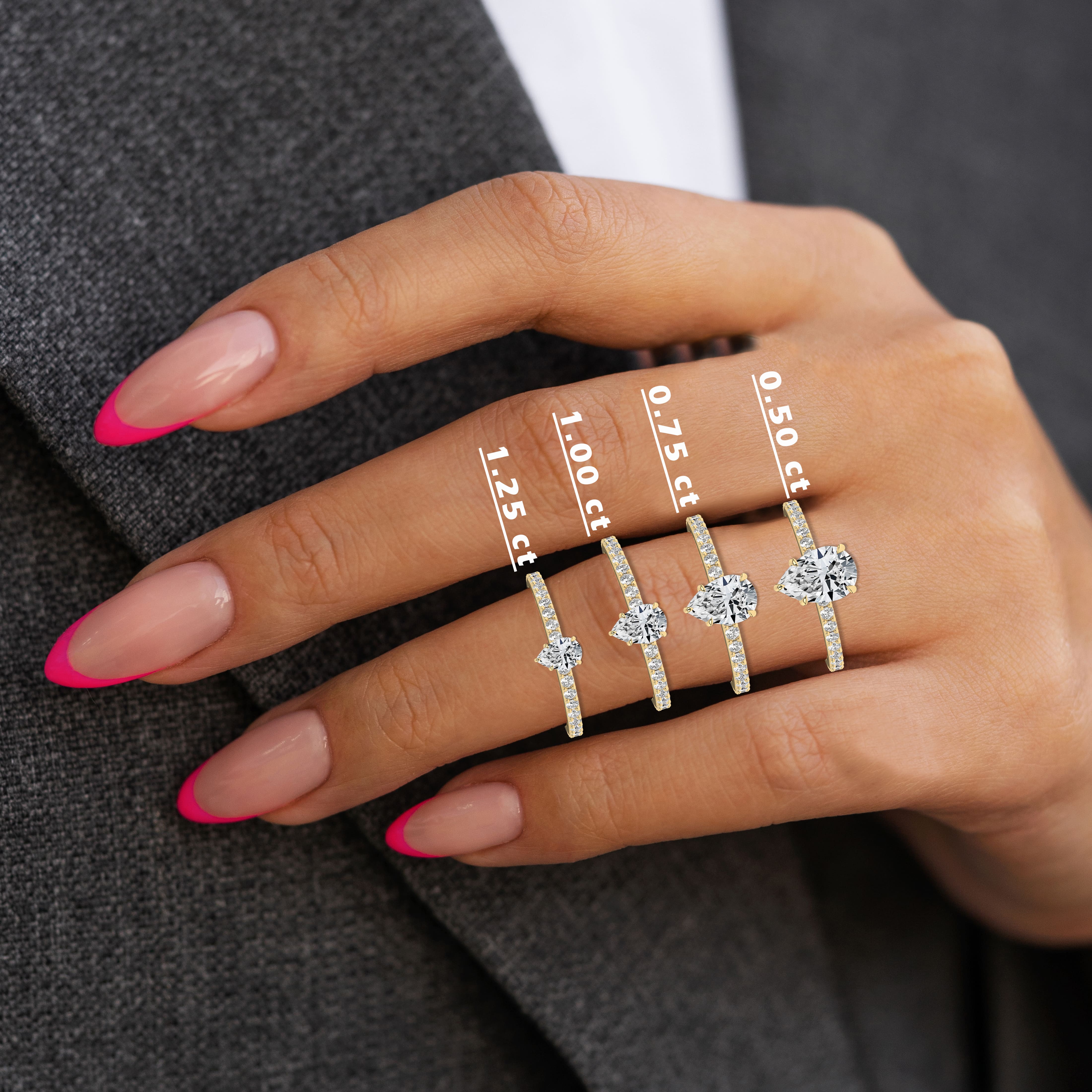 pear shape diamond engagement ring on woman hand