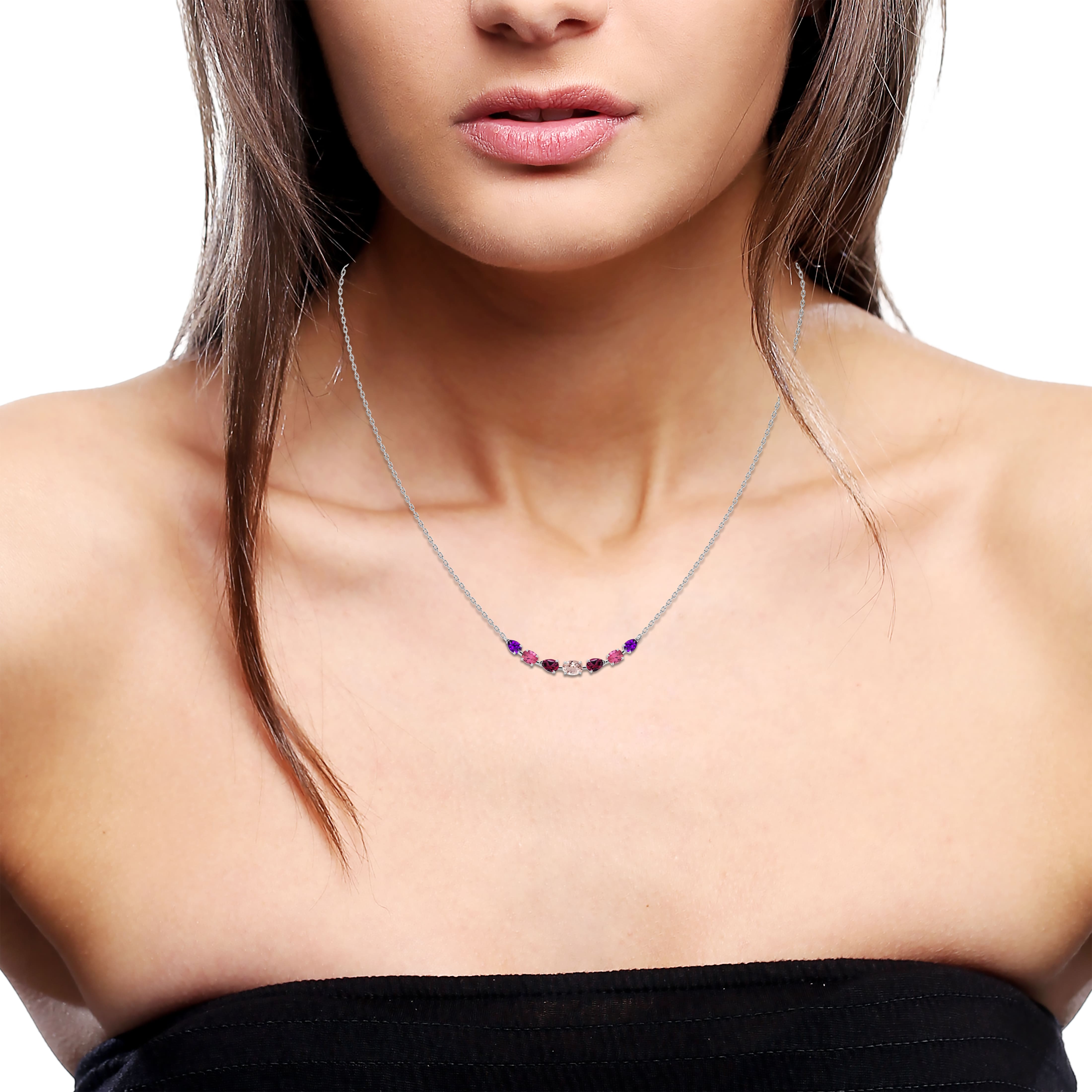 Gemstone cluster necklace on model neck