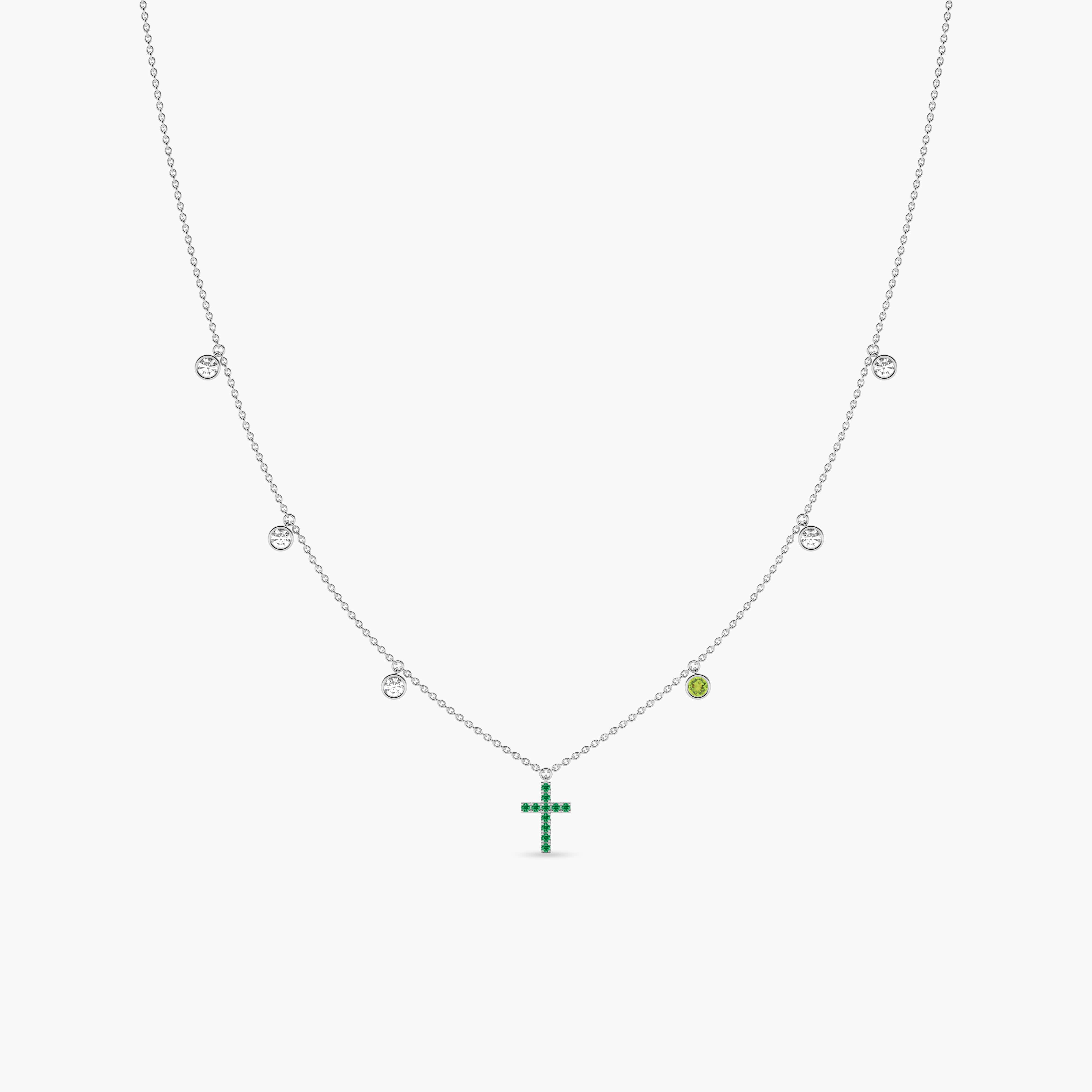 gold cross with emerald